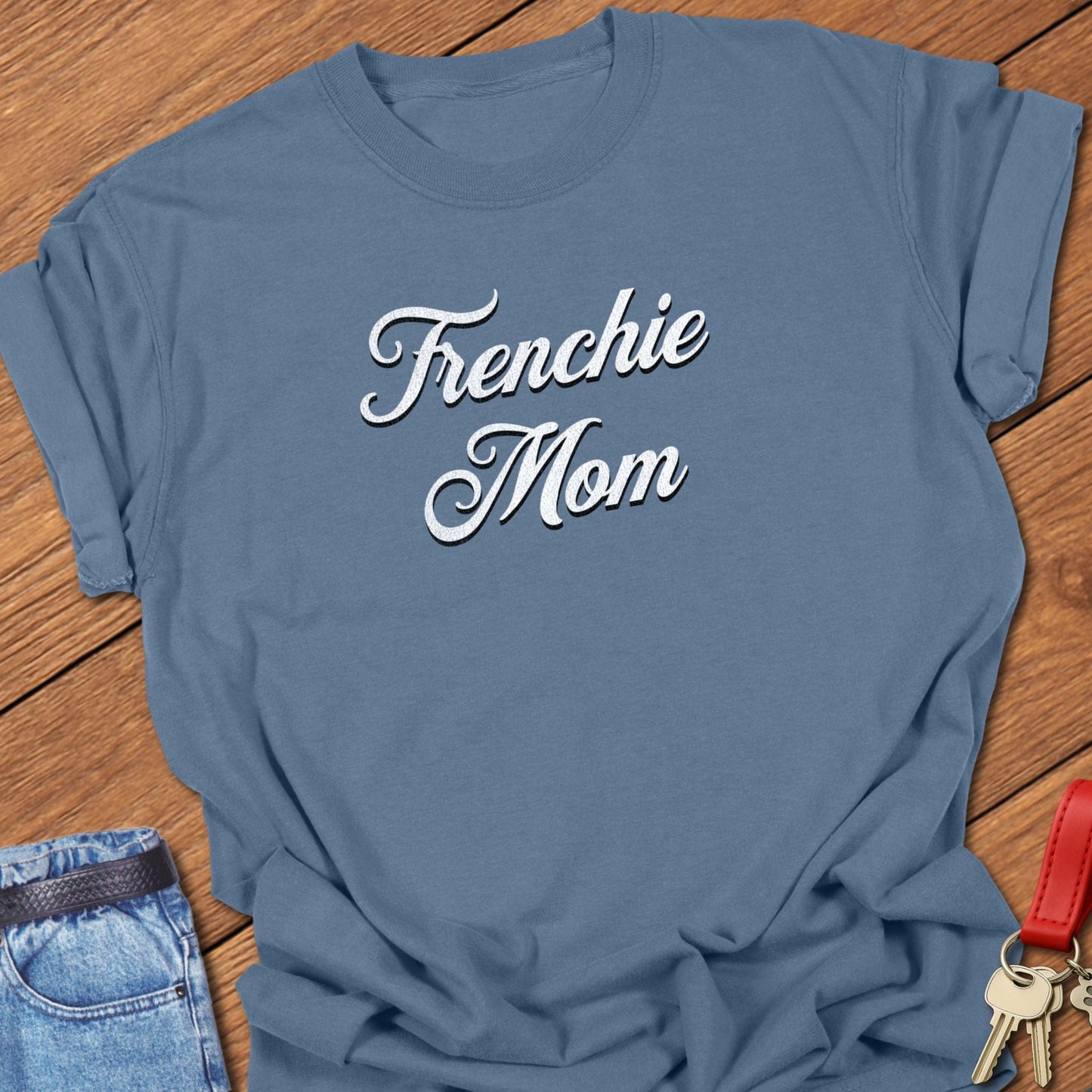 French bulldog script typography “Frenchie Mom” text design printed on blue jean Comfort Colors t shirt