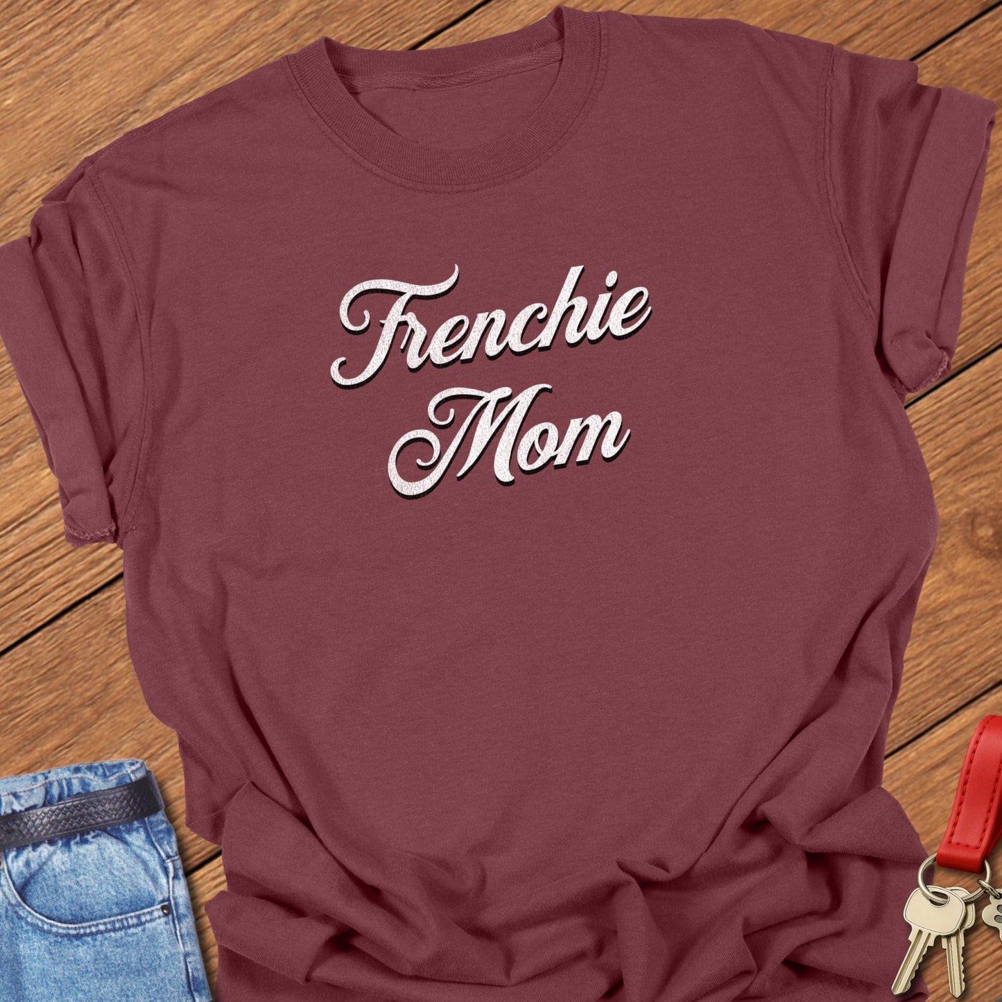 French bulldog script typography “Frenchie Mom” text design printed on brick Comfort Colors t shirt