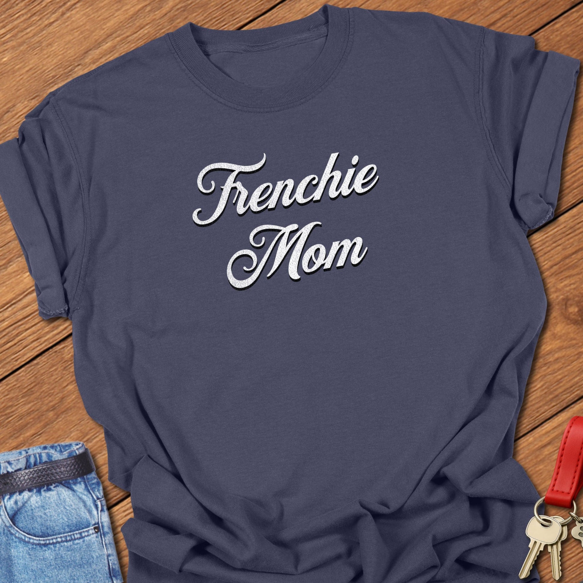 French bulldog script typography “Frenchie Mom” text design printed on navy Comfort Colors t shirt