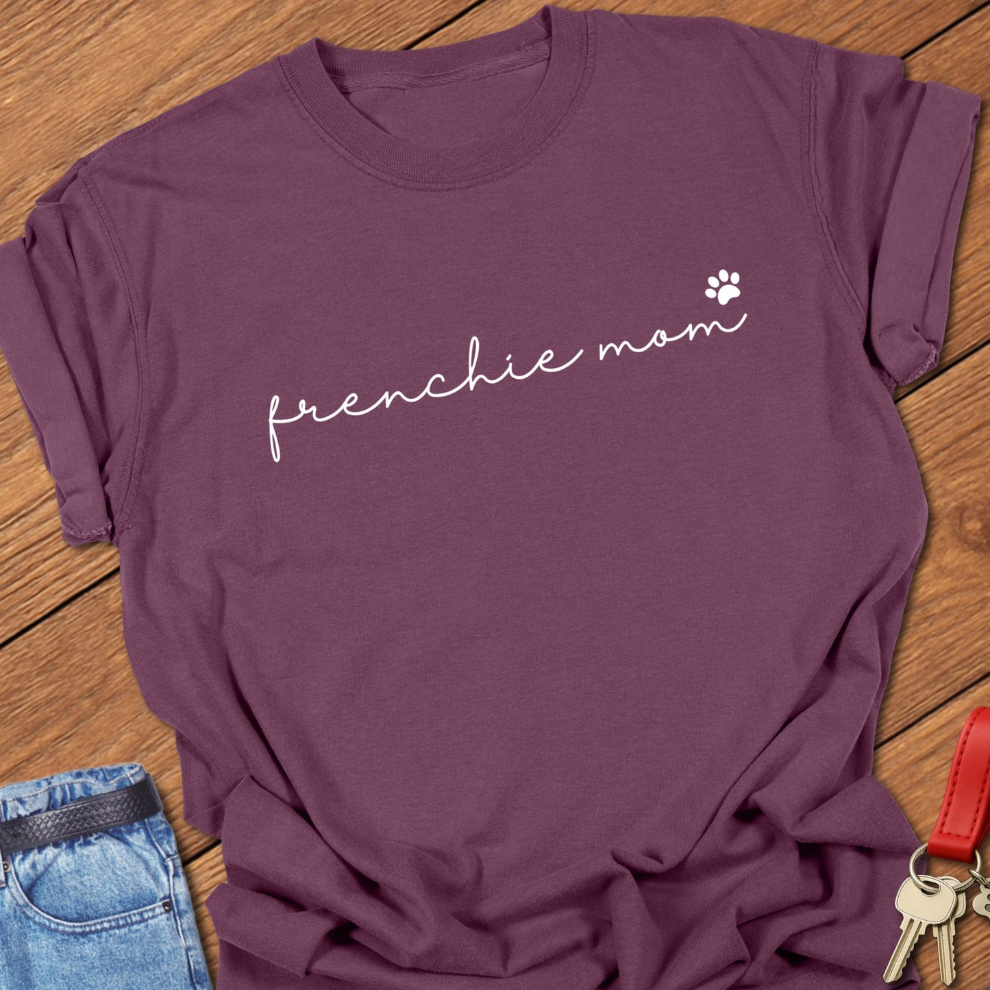 French bulldog minimalist script typography “frenchie mom” with small paw icon printed on berry Comfort Colors t shirt
