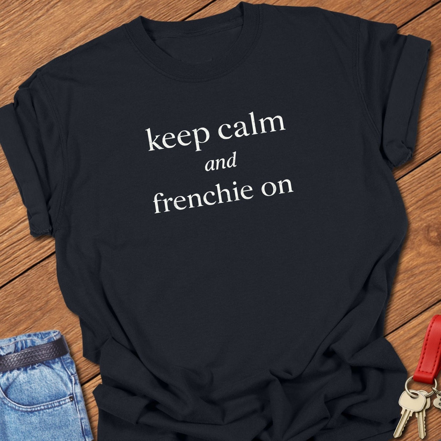 French bulldog keep calm and frenchie on text graphic printed on black Comfort Colors t shirt.