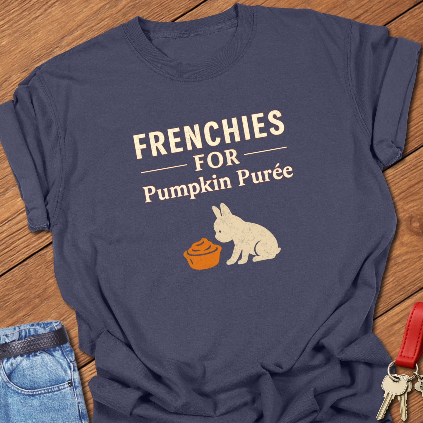 French bulldog seasonal food illustration with pumpkin purée bowl graphic and bold typography printed on navy Comfort Colors t shirt
