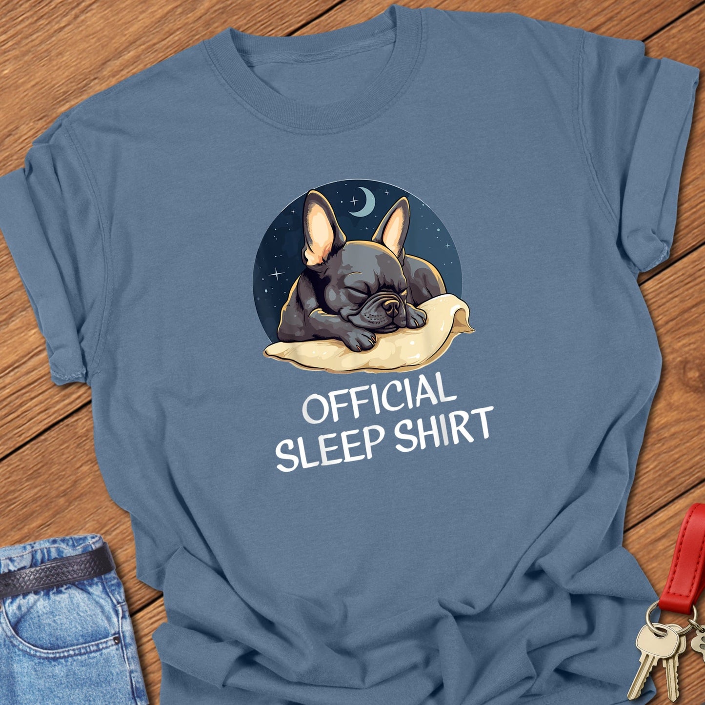 French bulldog sleeping illustration with “Official Sleep Shirt” text printed on blue jean Comfort Colors t shirt