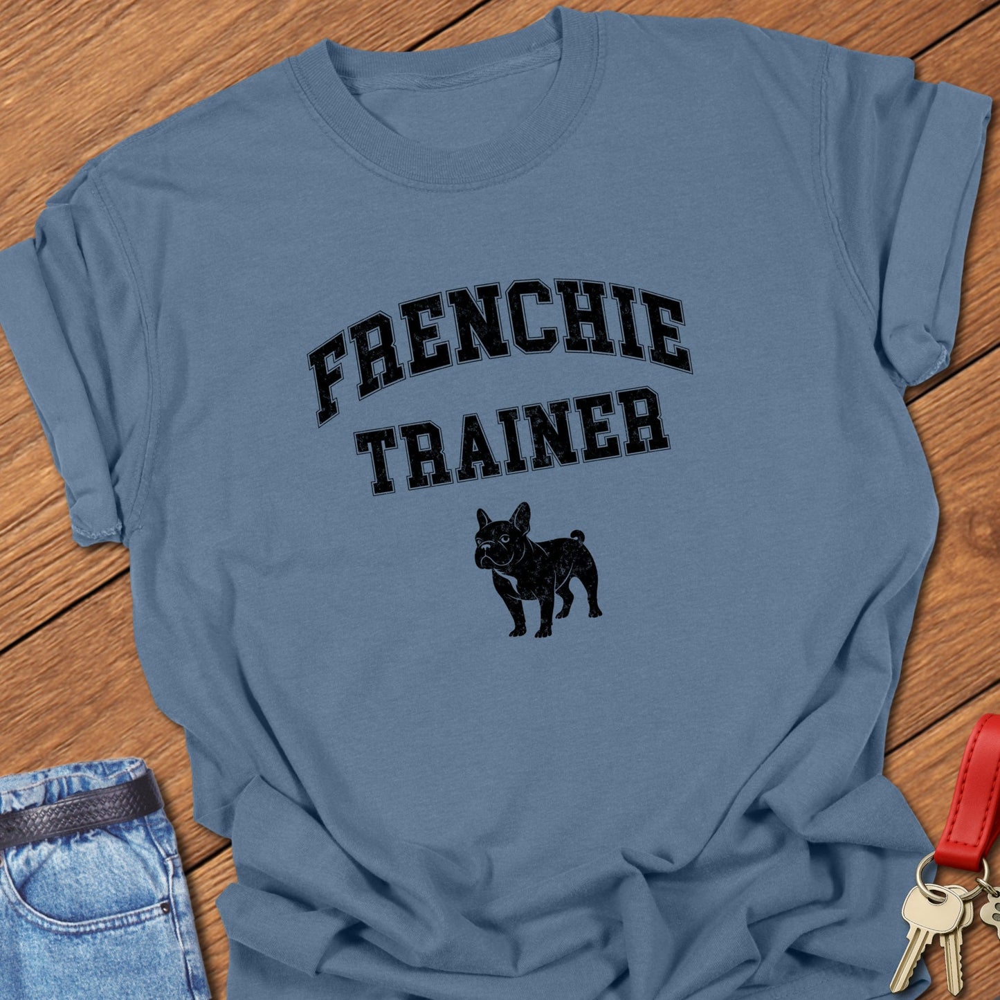 French bulldog trainer varsity-style typography with small Frenchie silhouette printed on blue jean Comfort Colors t shirt