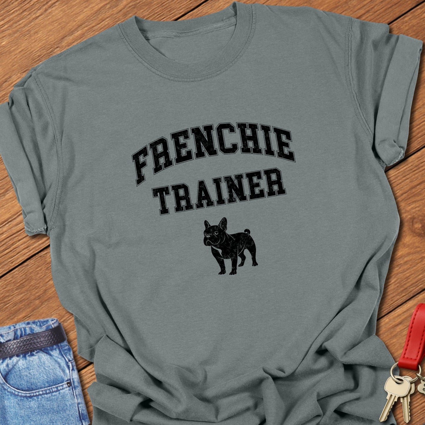 French bulldog trainer varsity-style typography with small Frenchie silhouette printed on granite Comfort Colors t shirt