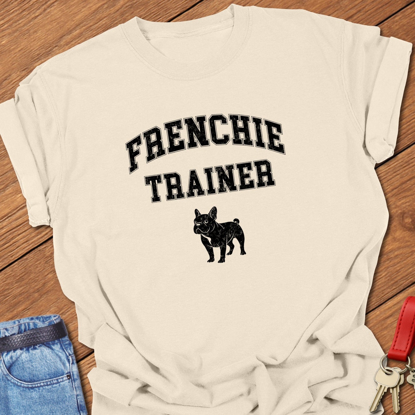 French bulldog trainer varsity-style typography with small Frenchie silhouette printed on ivory Comfort Colors t shirt