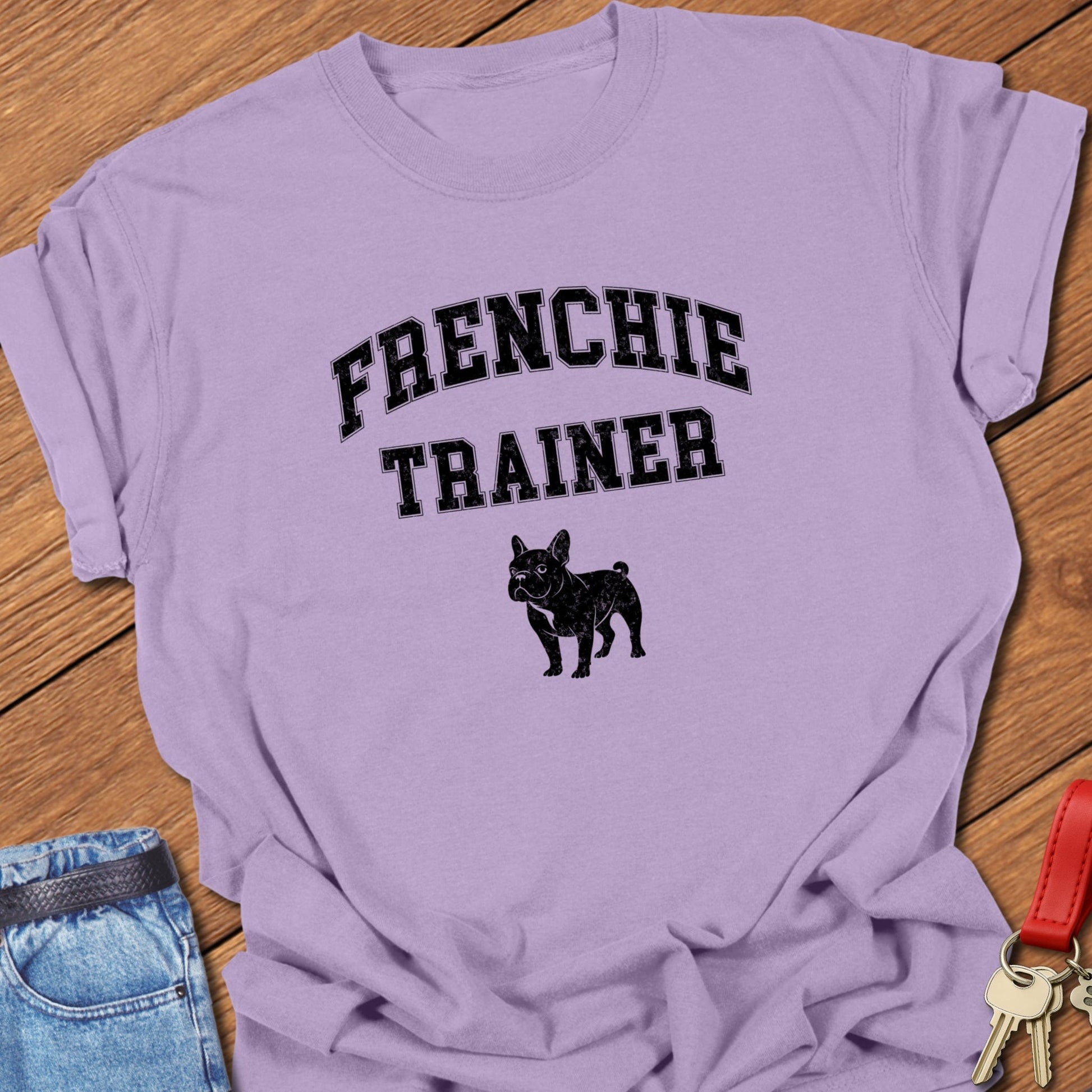 French bulldog trainer varsity-style typography with small Frenchie silhouette printed on orchid Comfort Colors t shirt