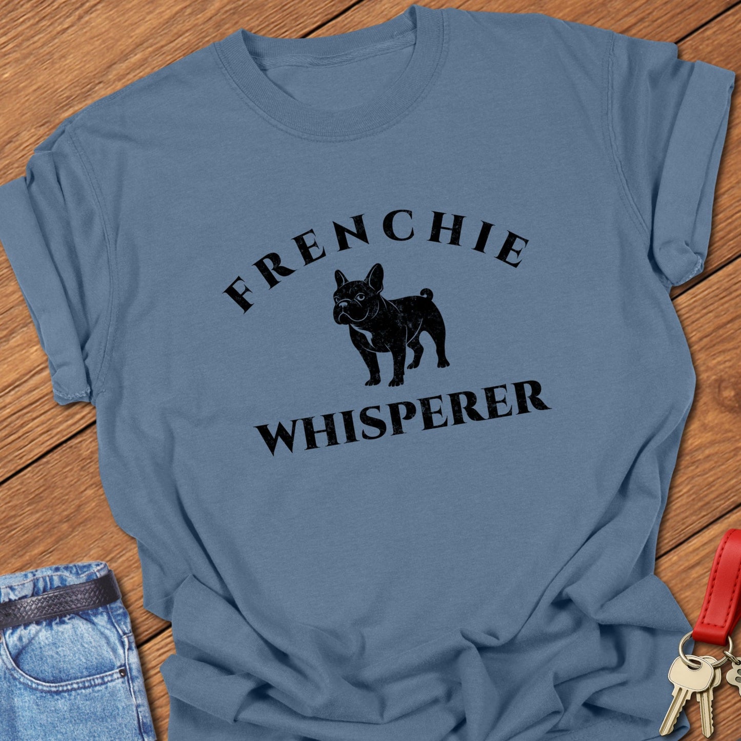 French bulldog “Frenchie Whisperer” text with vintage French bulldog silhouette graphic printed on bay Comfort Colors t shirt