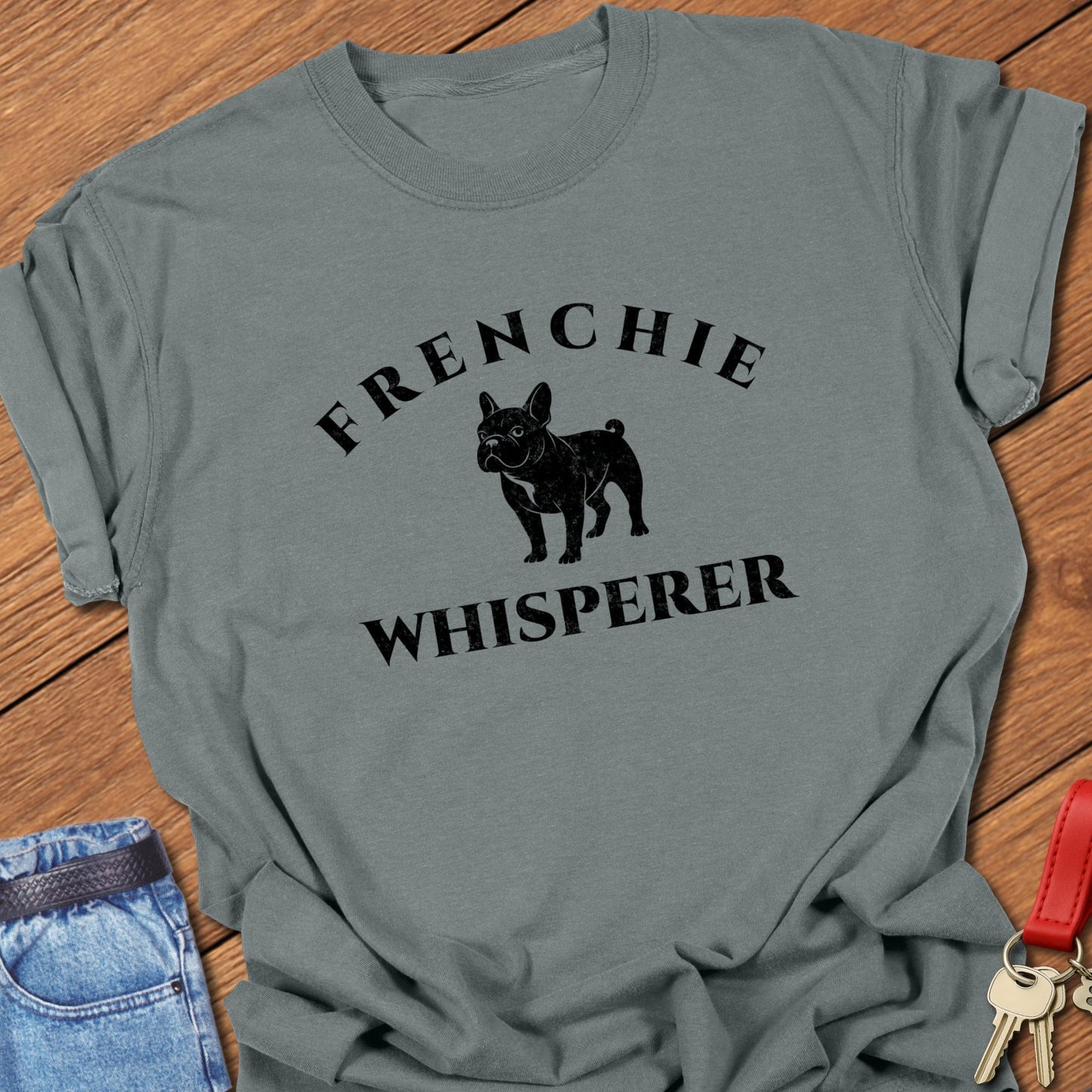 French bulldog “Frenchie Whisperer” text with vintage French bulldog silhouette graphic printed on blue jean Comfort Colors t shirt