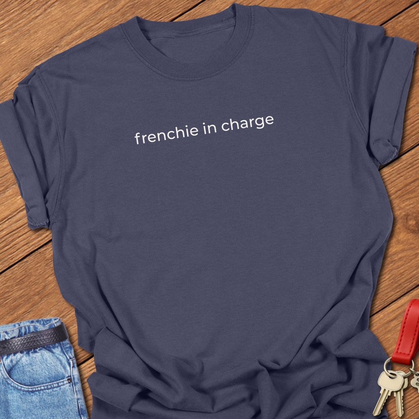 French bulldog frenchie in charge text graphic printed on navy Comfort Colors t shirt.