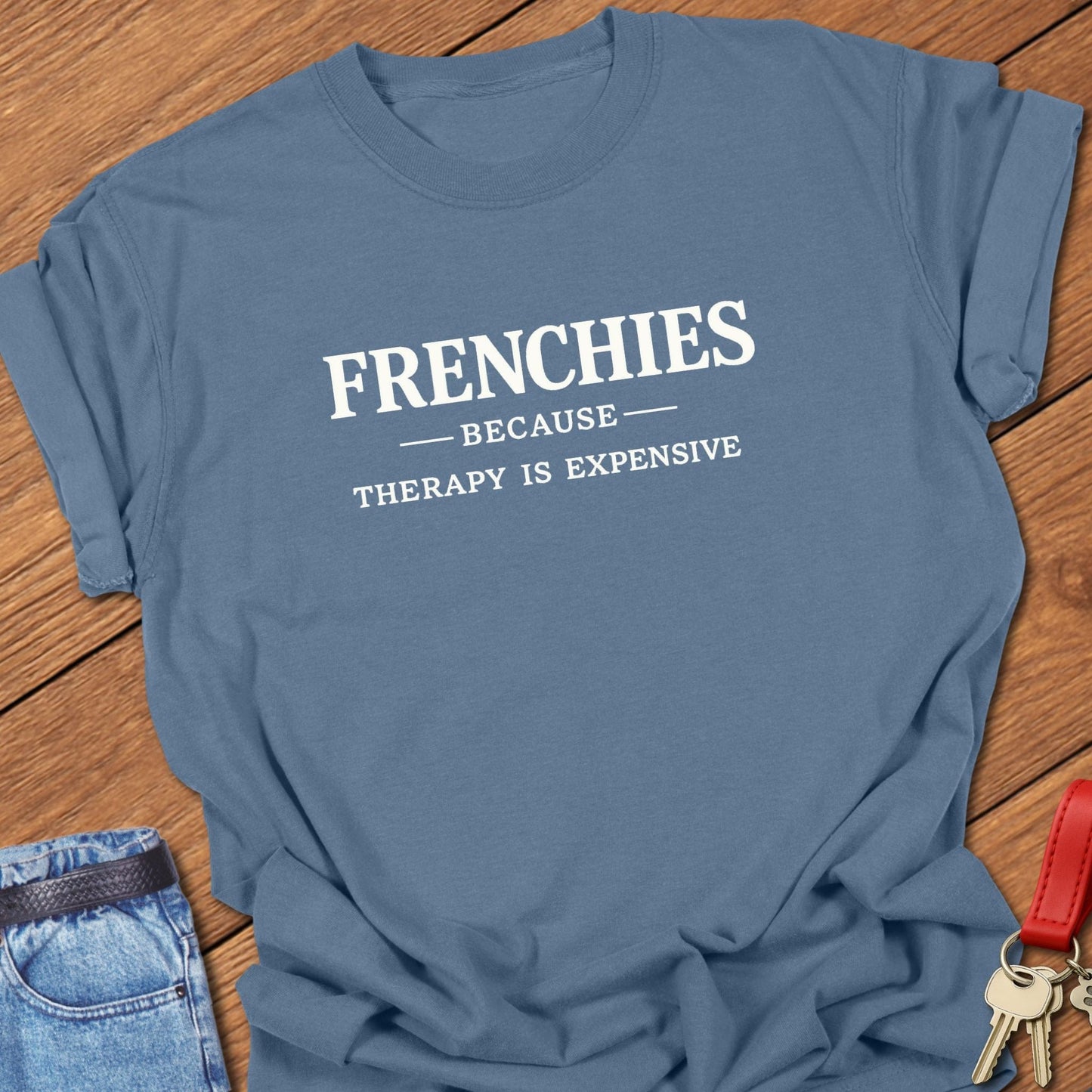 French bulldog frenchies because therapy is expensive text graphic printed on blue jean Comfort Colors t shirt.