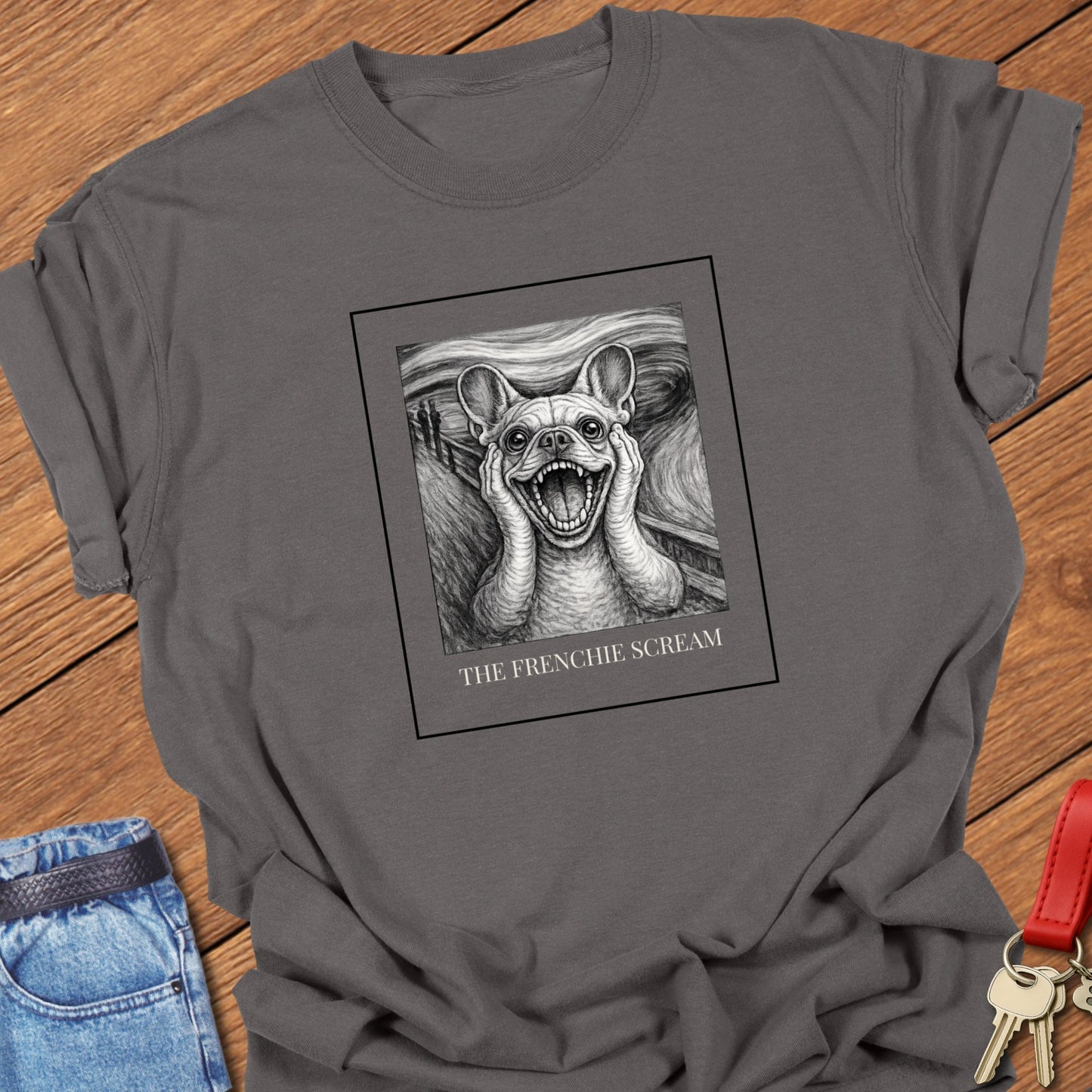 French Bulldog art parody illustration inspired by Edvard Munch’s famous painting The Scream, featuring a dramatic Frenchie expression on a museum-style graphic t-shirt in Pepper.
