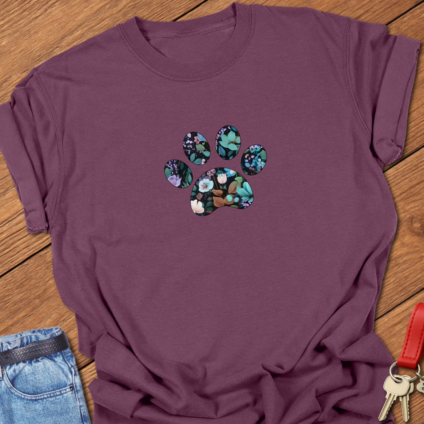 Floral paw print design featuring botanical flowers and leaves arranged inside a paw silhouette for a French Bulldog dog lover t-shirt printed on Comfort Colors garment dyed cotton in Berry.