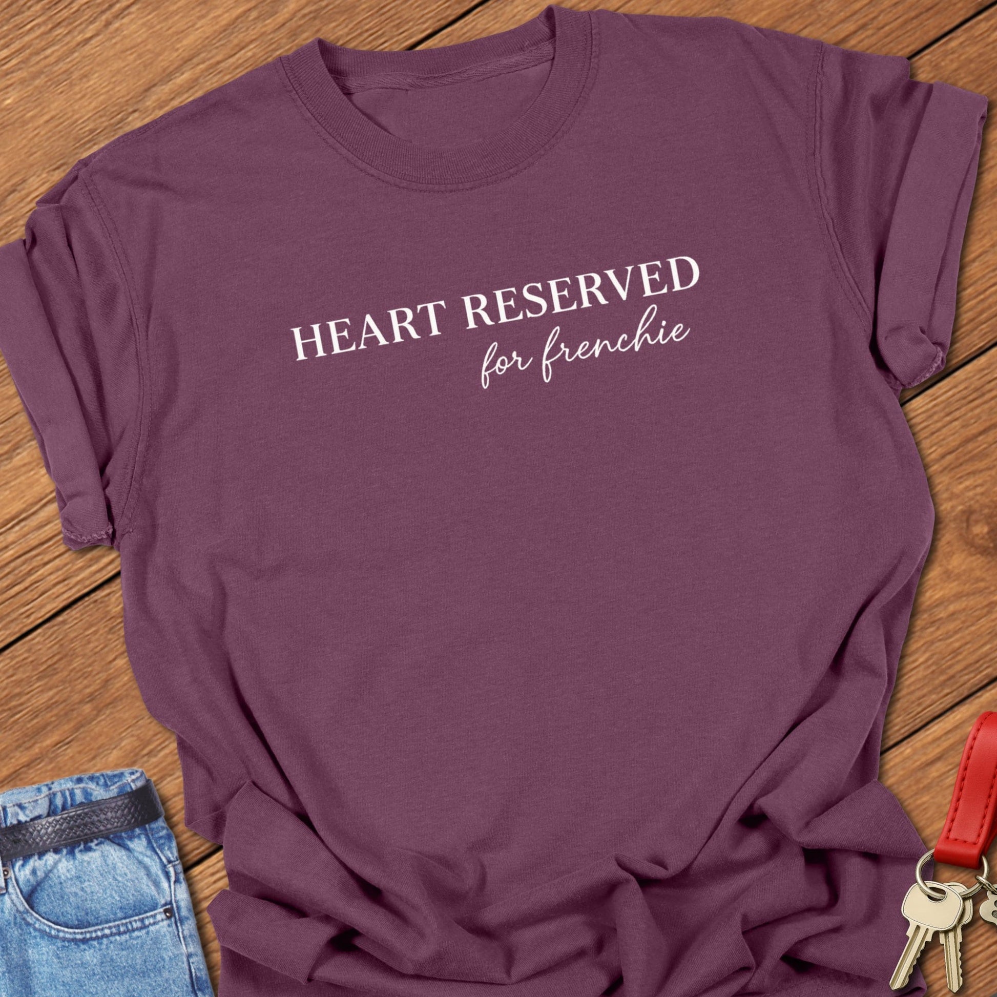 French bulldog heart reserved for frenchie text graphic printed on berry Comfort Colors t shirt.