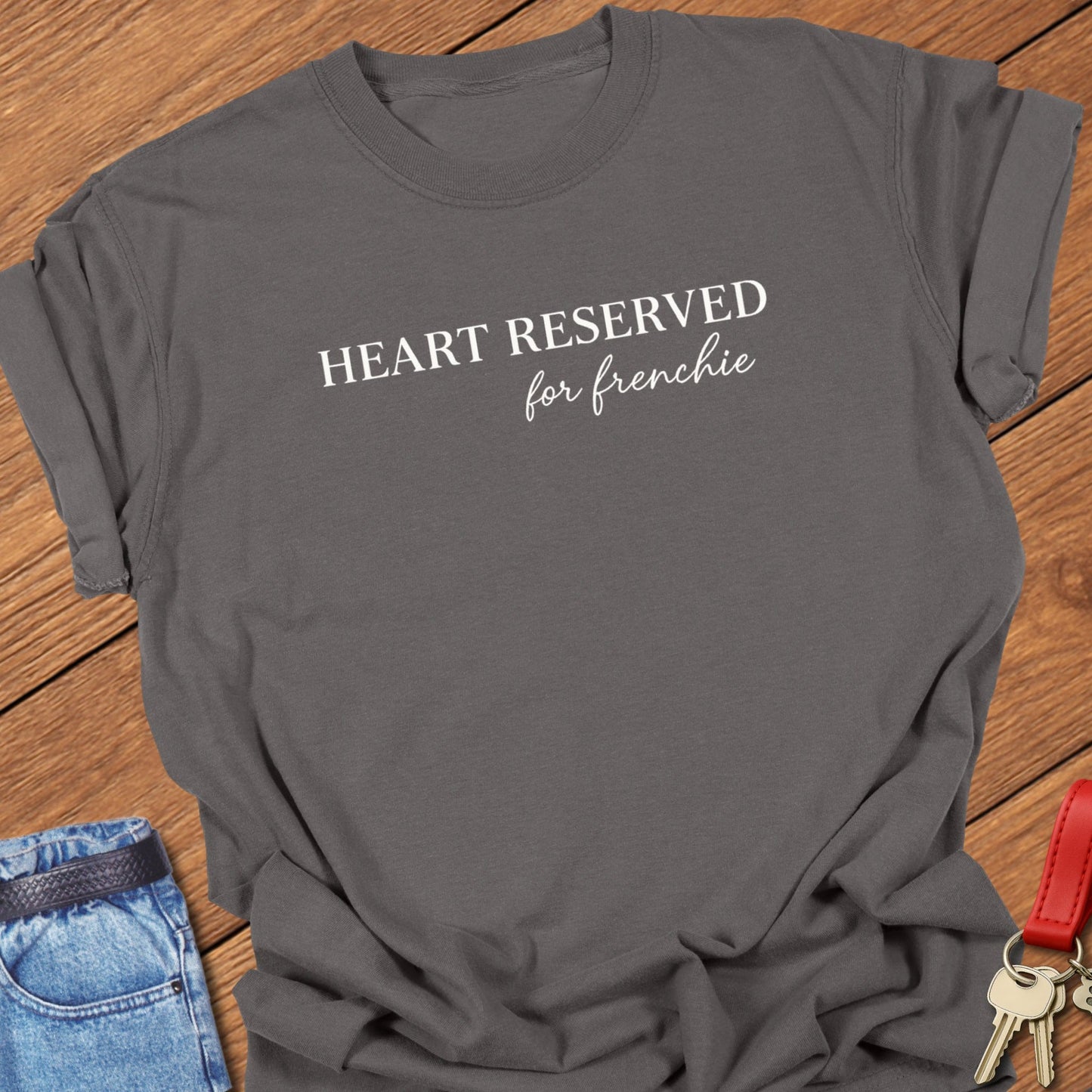 French bulldog heart reserved for frenchie text graphic printed on pepper Comfort Colors t shirt.