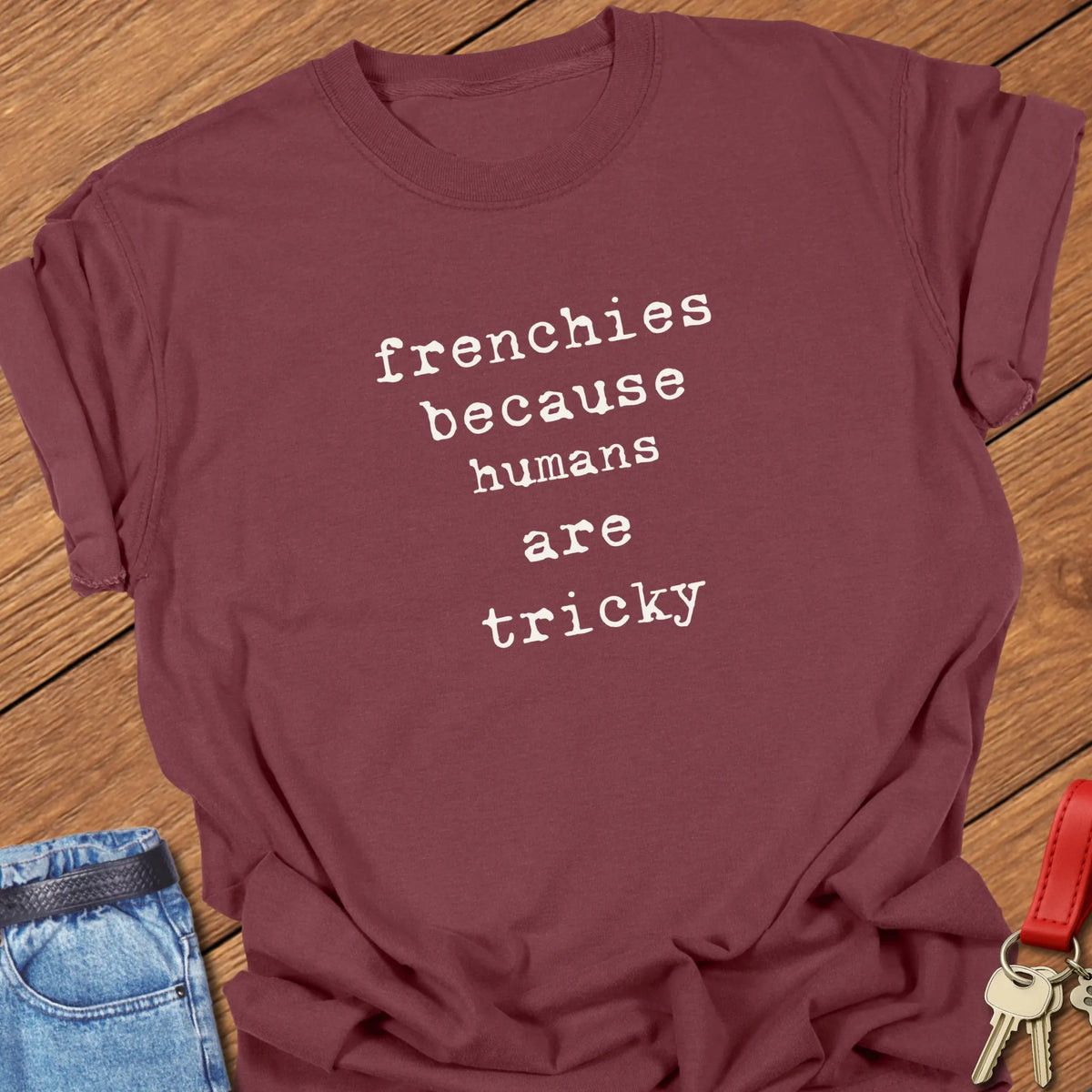 Brick Comfort Colors French Bulldog t-shirt featuring the phrase "Humans Are Tricky" in vintage ivory typewriter typography.