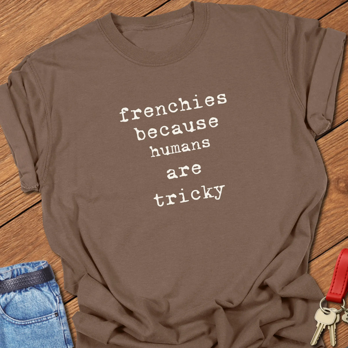 Espresso Comfort Colors French Bulldog t-shirt featuring the phrase "Humans Are Tricky" in vintage ivory typewriter typography.