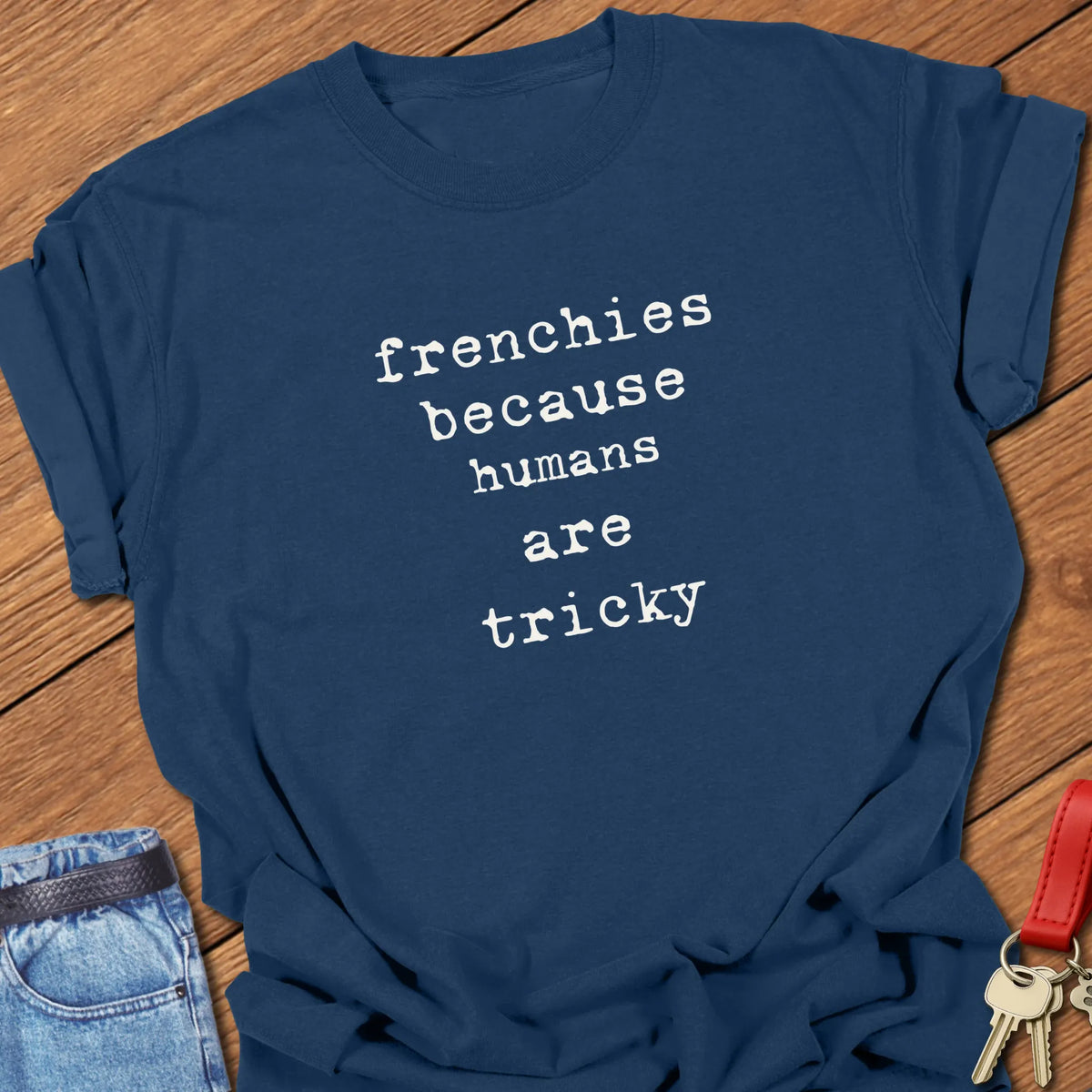 True Navy Comfort Colors French Bulldog t-shirt featuring the phrase "Humans Are Tricky" in vintage ivory typewriter typography.