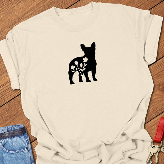 French bulldog silhouette with floral cutout design printed on ivory Comfort Colors t shirt.
