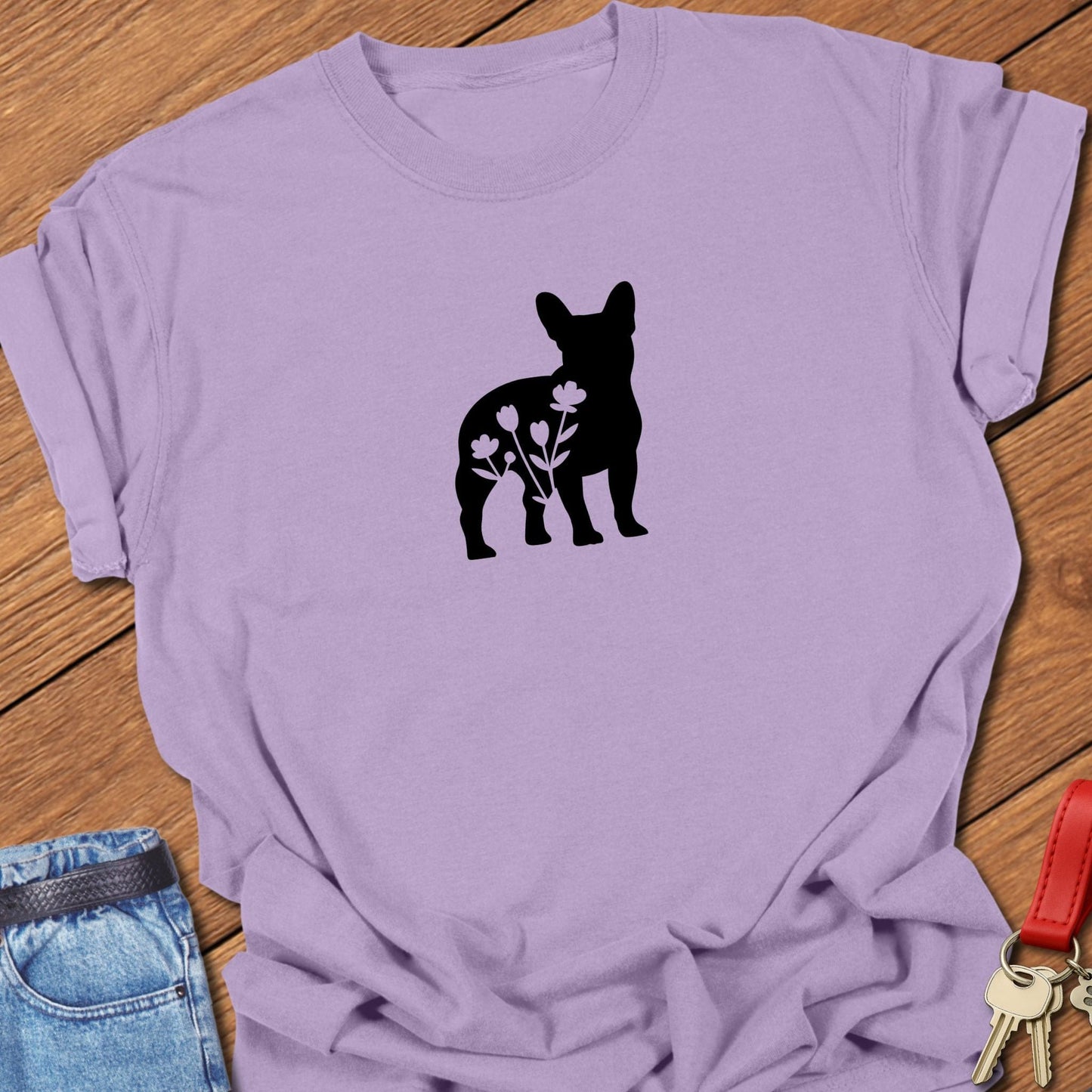 French bulldog silhouette with floral negative space design printed on orchid Comfort Colors t shirt