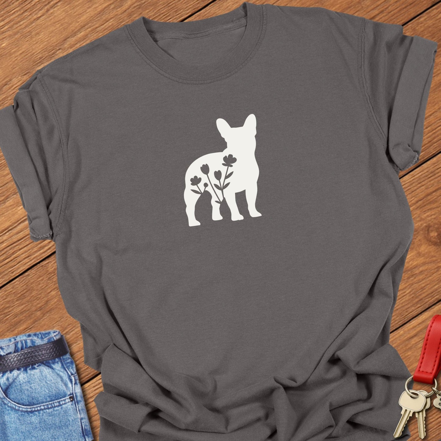 French bulldog silhouette with floral negative space design printed on pepper Comfort Colors t shirt
