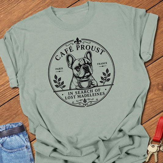 Lost Madeleines French Bulldog graphic t-shirt featuring "In Search of Lost Madeleines" literary café artwork with a thoughtful Frenchie holding a coffee cup in Bay color.