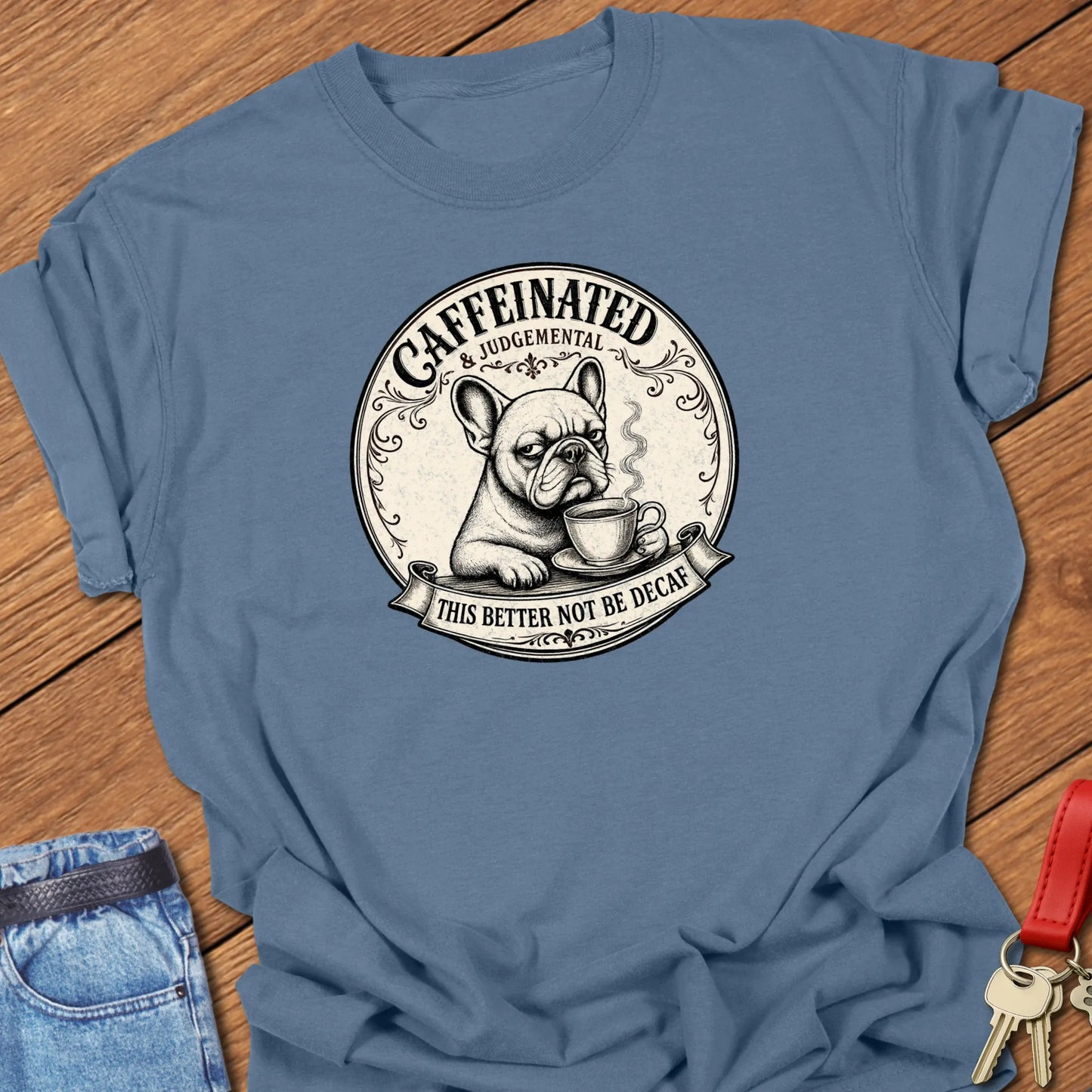 Not Decaf French Bulldog graphic t-shirt featuring "Caffeinated & Judgemental" and "This Better Not Be Decaf" slogans with vintage café artwork in Blue Jean color.
