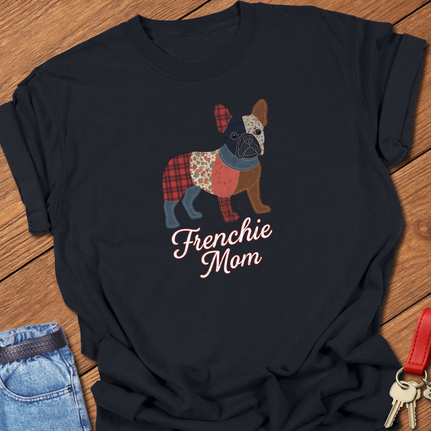 French bulldog patchwork-style illustration with mixed fabric textures and “Frenchie Mom” lettering printed on berry Comfort Colors t shirt