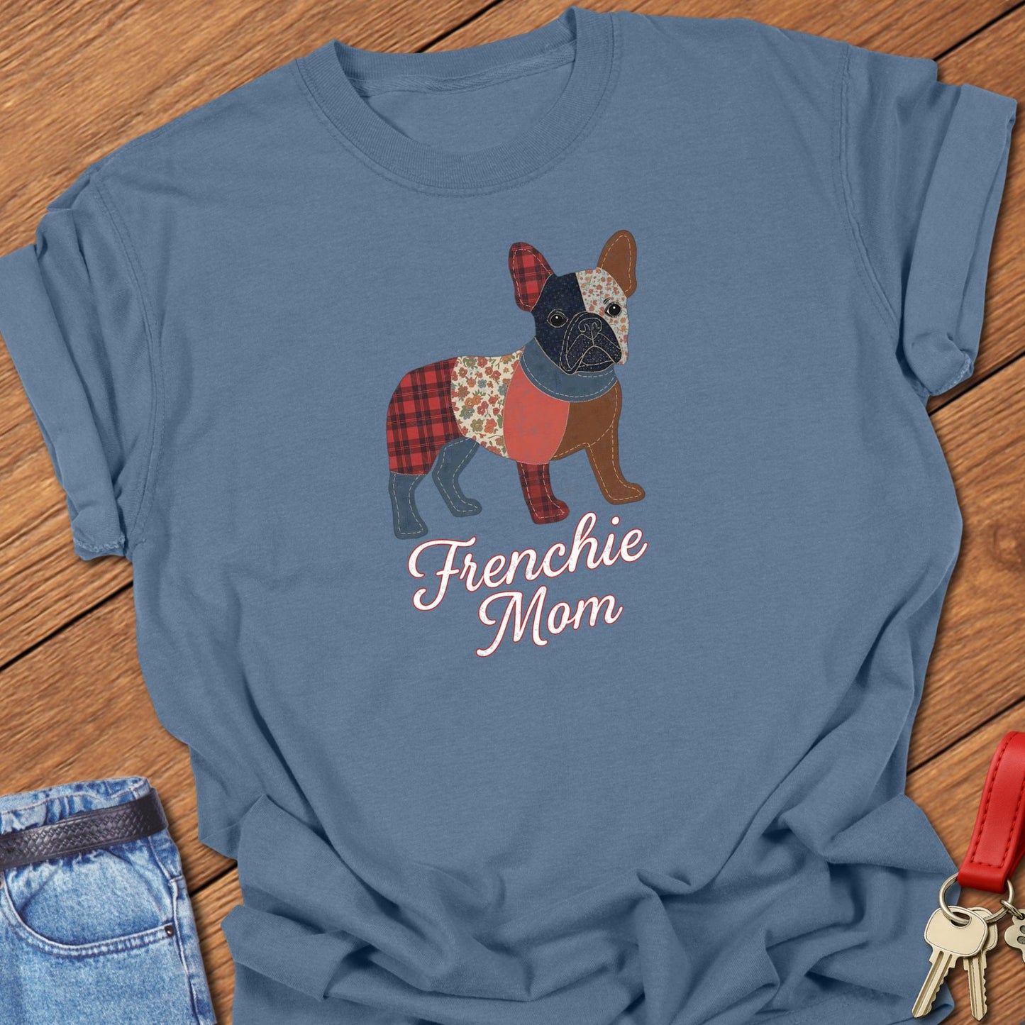 French bulldog patchwork-style illustration with mixed fabric textures and “Frenchie Mom” lettering printed on blue jean Comfort Colors t shirt