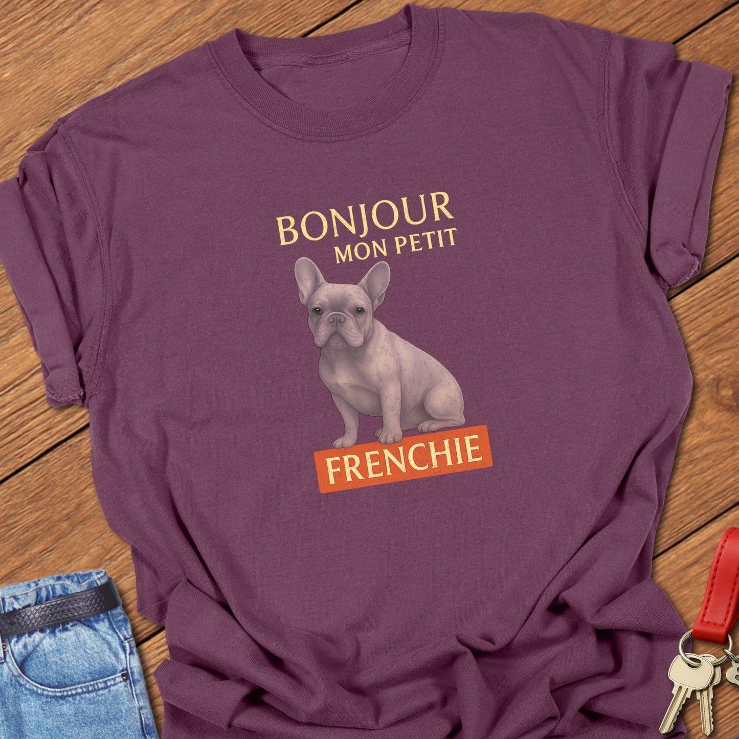 French bulldog vintage French typography illustration with pastel Frenchie graphic and Bonjour mon petit text printed on berry Comfort Colors t shirt