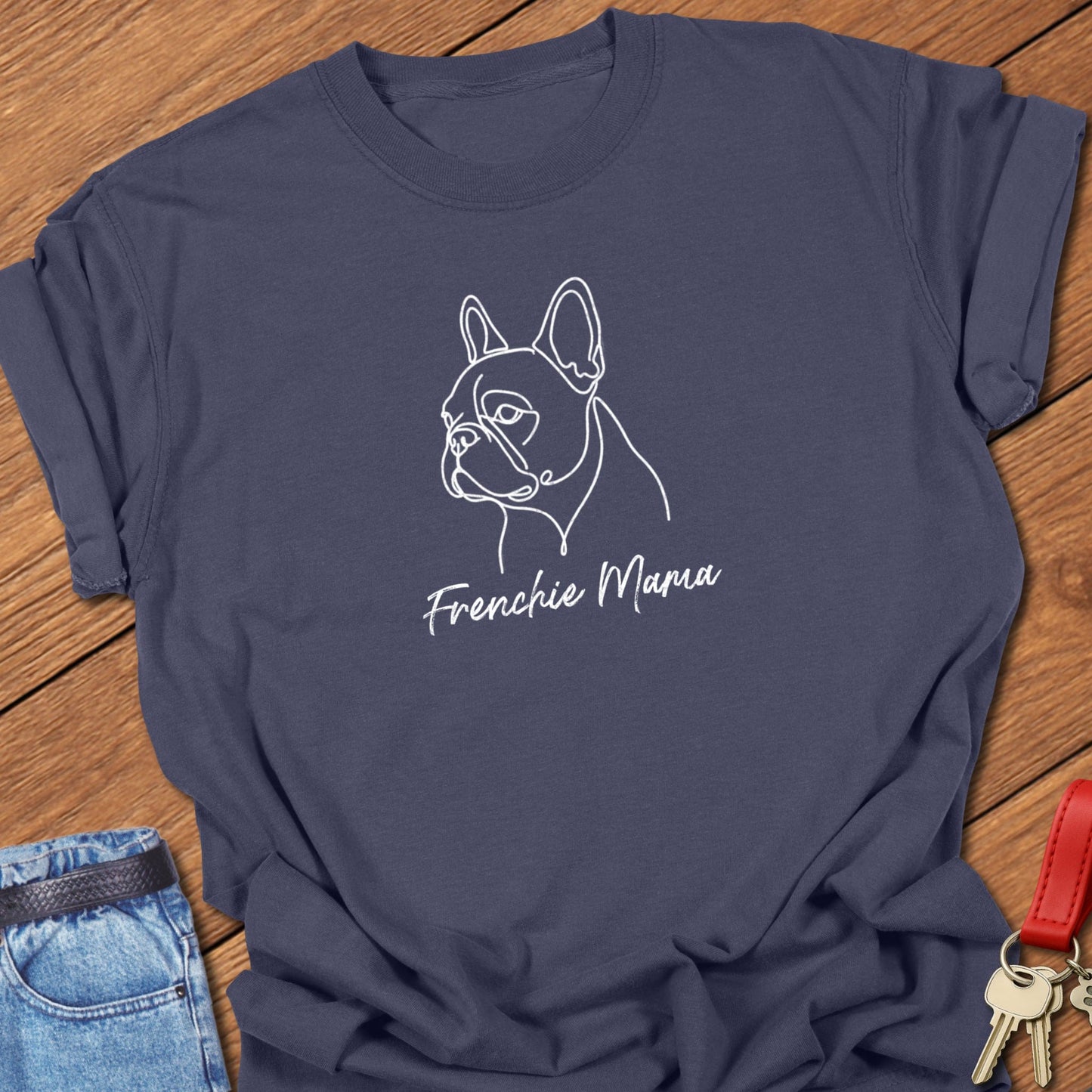 French bulldog minimalist line art portrait with “Frenchie Mama” script text printed on navy Comfort Colors t shirt.
