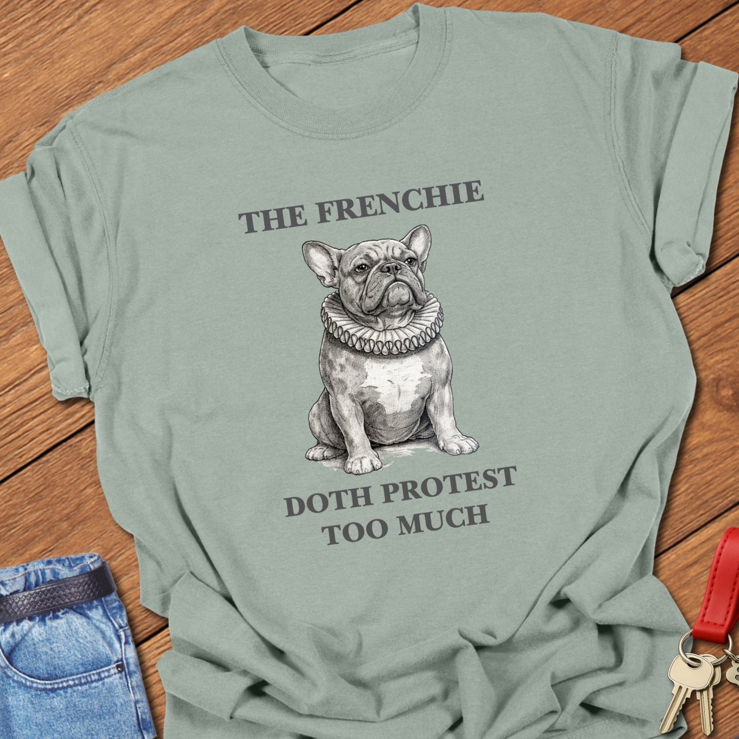 French bulldog vintage engraved illustration with ruffled collar and humorous text printed on bay Comfort Colors t shirt.