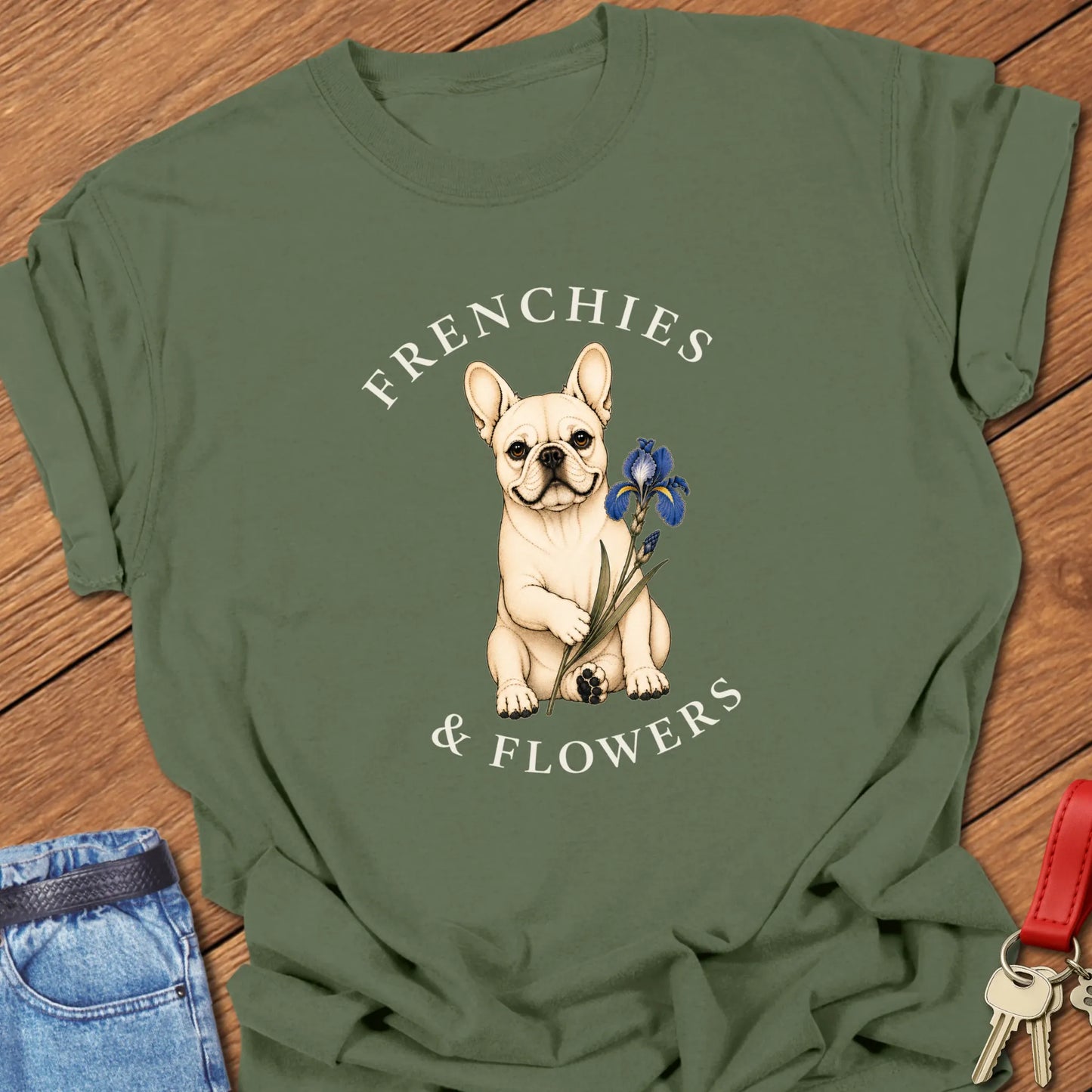 Frenchie Blue Iris botanical French Bulldog illustration with blue iris flower and Frenchies & Flowers typography printed on Comfort Colors® t-shirt in Moss Color