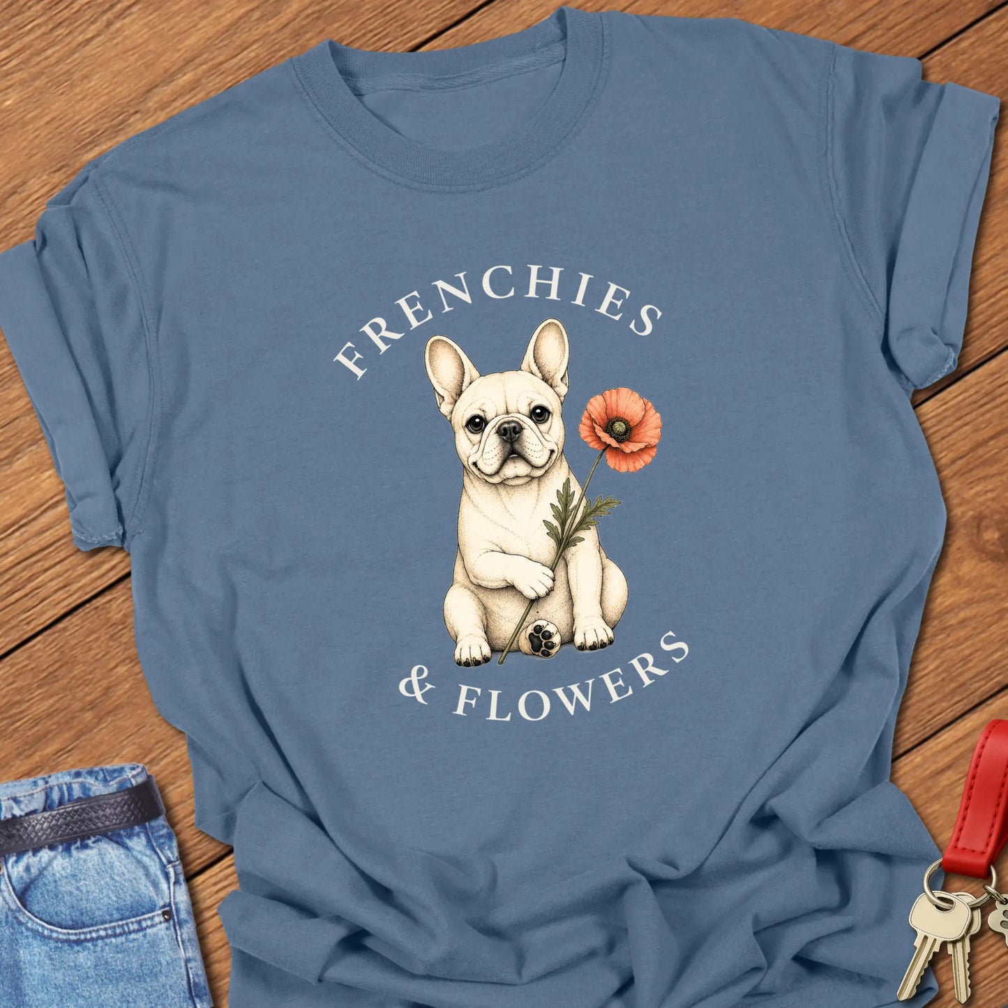 Frenchie Poppy botanical French Bulldog illustration with red poppy and Frenchies & Flowers typography printed on Comfort Colors® t-shirt in Blue Jean Color