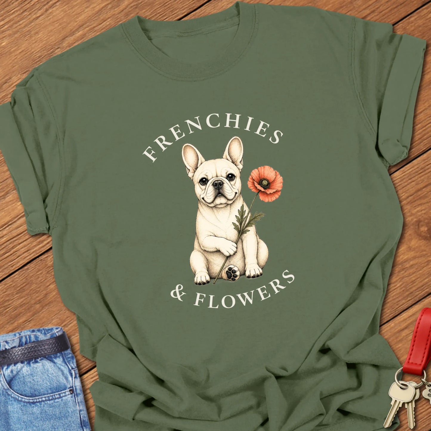 Frenchie Poppy botanical French Bulldog illustration with red poppy and Frenchies & Flowers typography printed on Comfort Colors® t-shirt in Moss Color