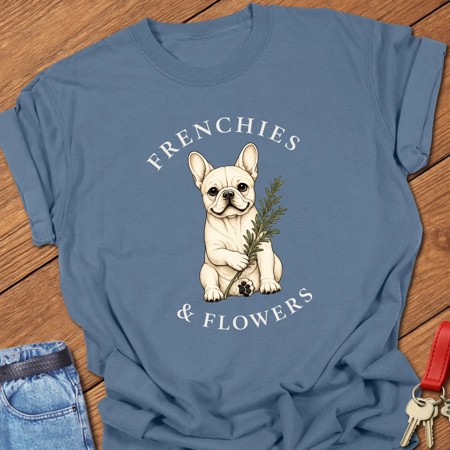 Frenchie Rosemary botanical French Bulldog illustration with rosemary sprig and Frenchies & Flowers typography printed on Comfort Colors® t-shirt in Blue Jean Color