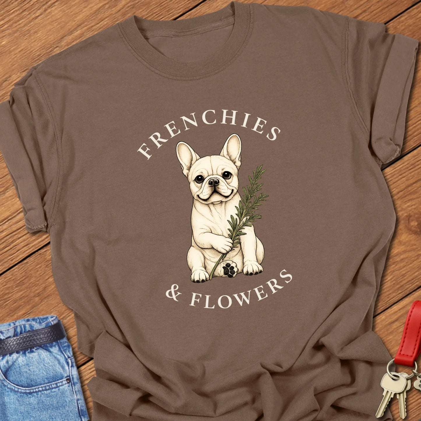 Frenchie Rosemary botanical French Bulldog illustration with rosemary sprig and Frenchies & Flowers typography printed on Comfort Colors® t-shirt in Espresso Color