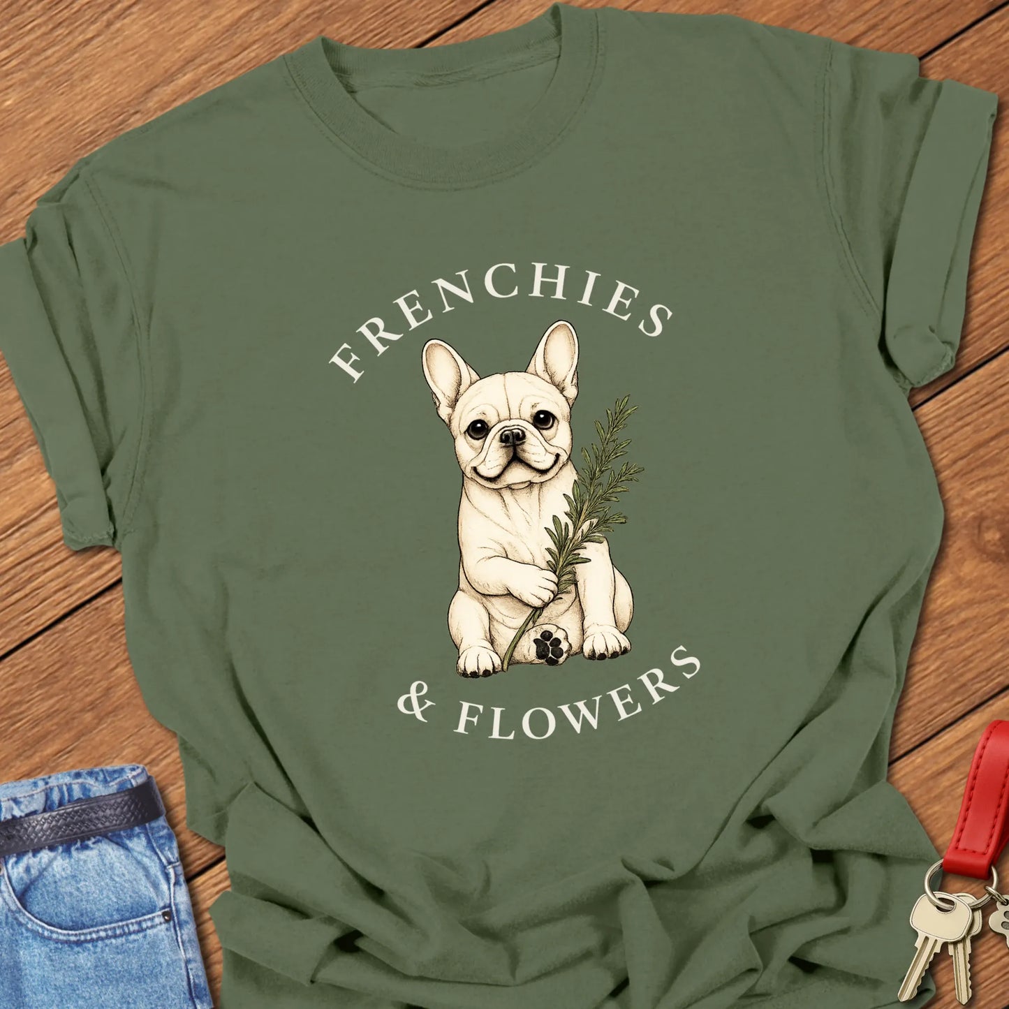 Frenchie Rosemary botanical French Bulldog illustration with rosemary sprig and Frenchies & Flowers typography printed on Comfort Colors® t-shirt in Moss Color