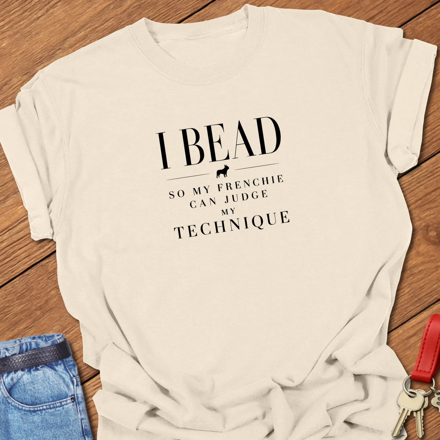I Bead So My Frenchie Can Judge My Beading text design along with a French Bulldog silhouette on a Comfort Colors 1717 cotton t shirt in Ivory color.