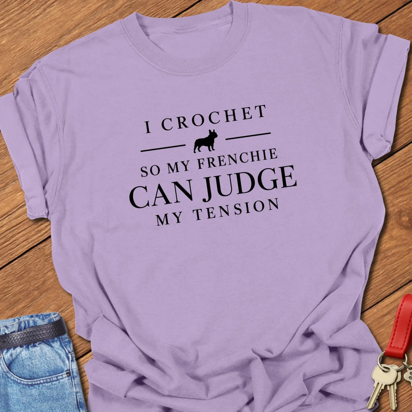 I Crochet So My Frenchie Can Judge My Tension text design featuring a French Bulldog silhouette on a Comfort Colors 1717 t shirt in Orchid color.
