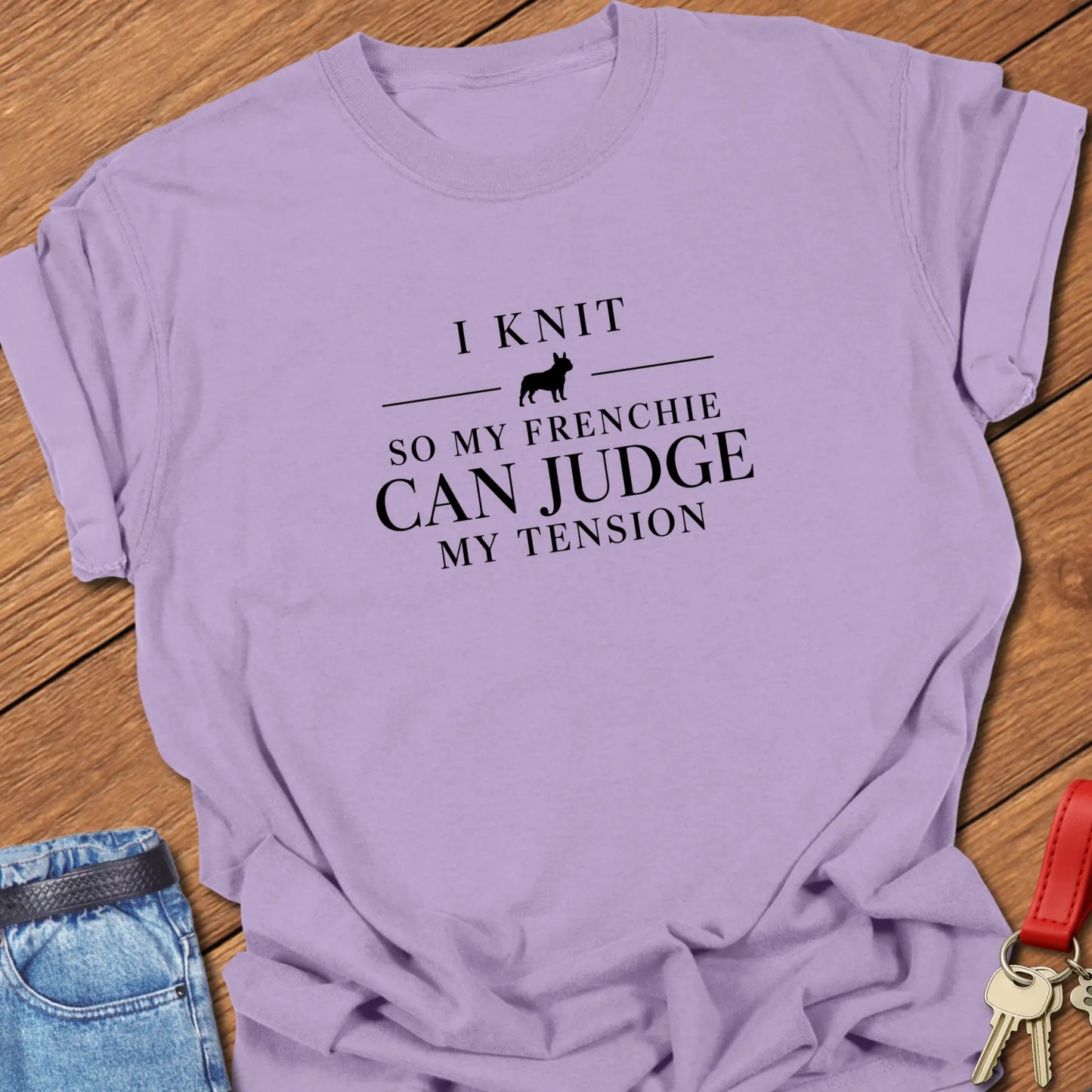 I Knit So My Frenchie Can Judge My Tension text design featuring a French Bulldog silhouette on a Comfort Colors 1717 t shirt in Orchid design.