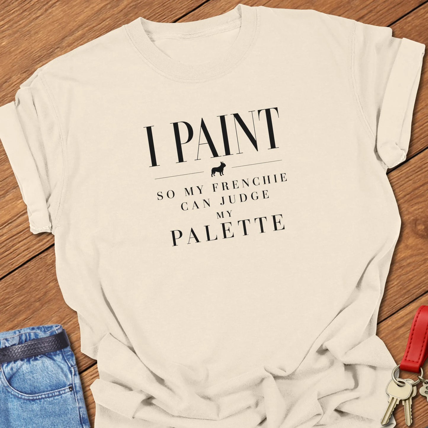 I Paint So My Frenchie Can Judge My Palette text design along with a French Bulldog silhouette on a Comfort Colors 1717 t shirt in Ivory color.