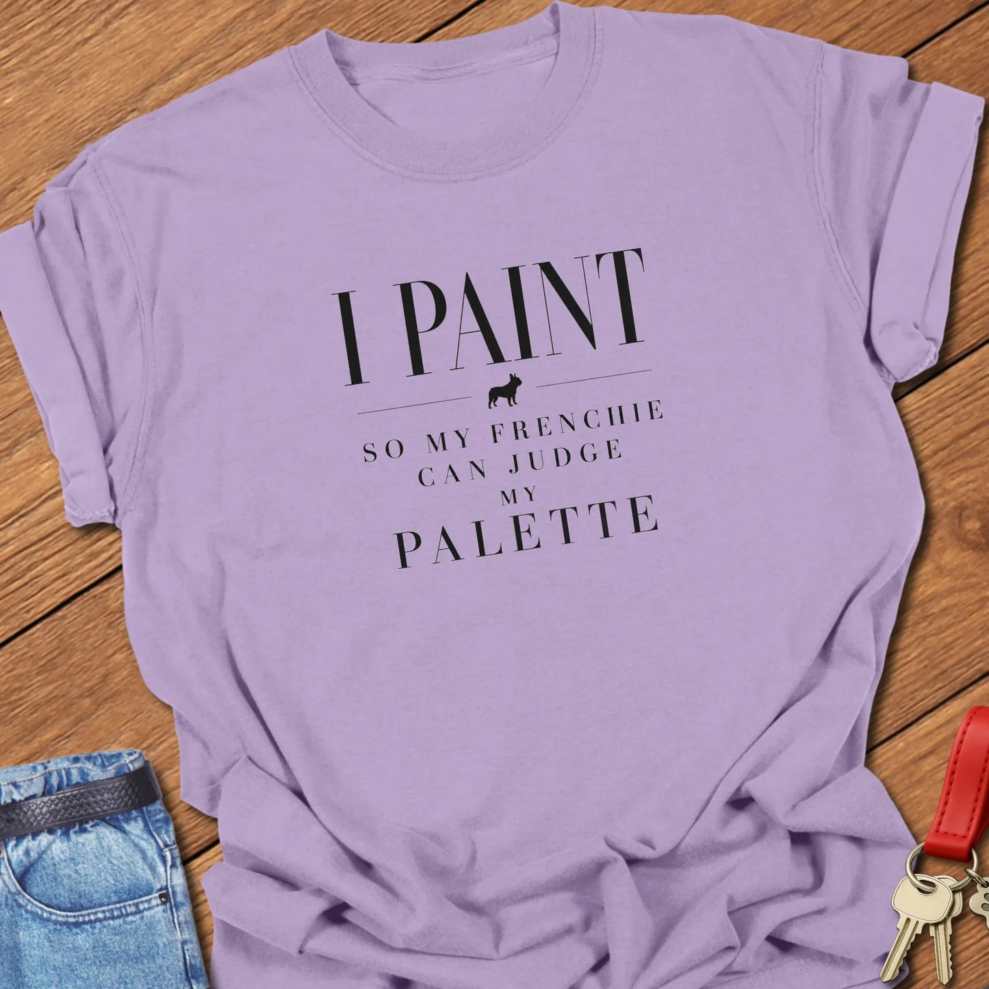 I Paint So My Frenchie Can Judge My Palette text design along with a French Bulldog silhouette on a Comfort Colors 1717 t shirt in Orchid color.