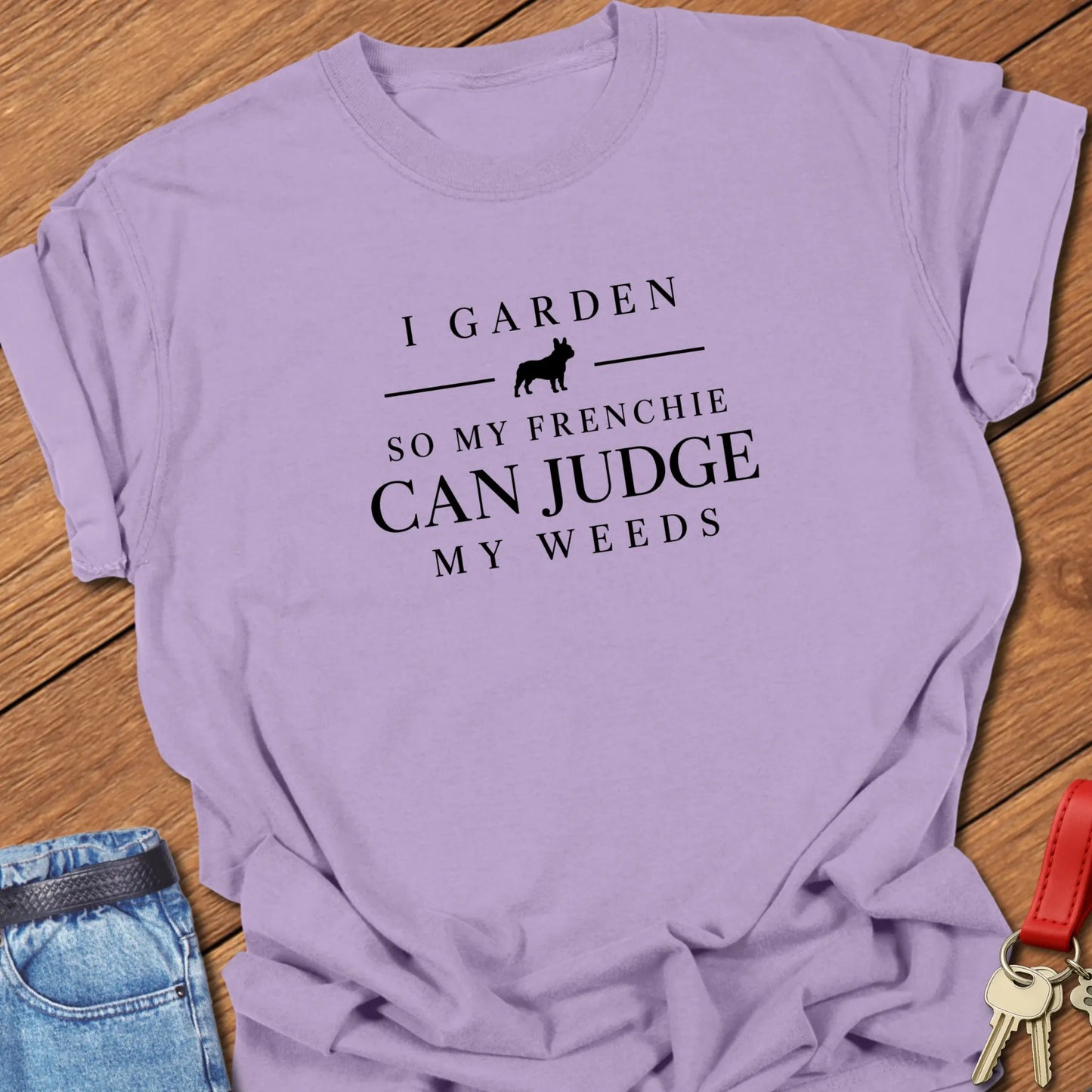 I Garden So My Frenchie Can Judge My Weeds text design along with a French Bulldog silhouette on a Comfort Colors 1717 t shirt in Orchid color.