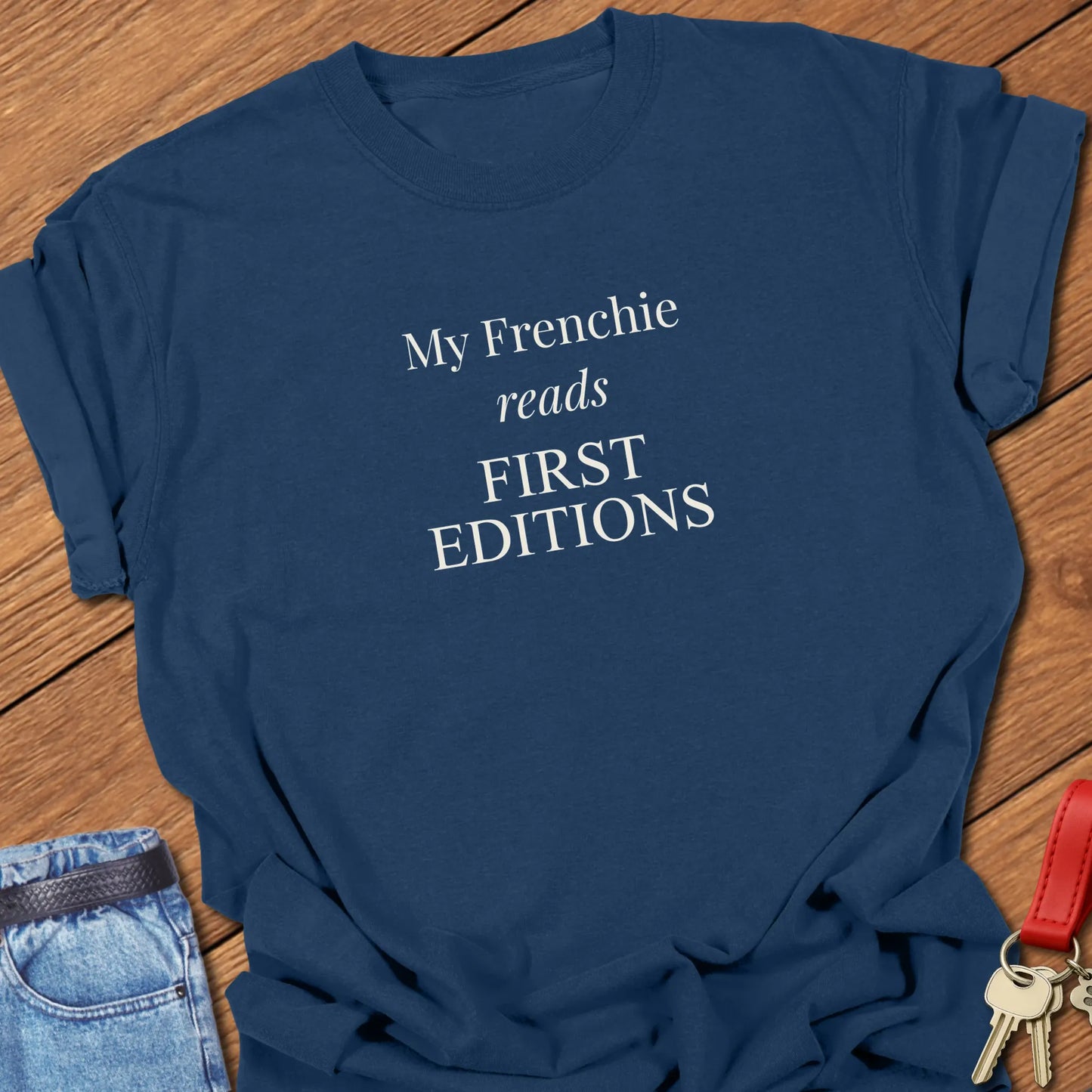 My Frenchie Reads First Editions French Bulldog t-shirt in True Navy displayed on a Comfort Colors® garment-dyed shirt featuring elegant serif typography.