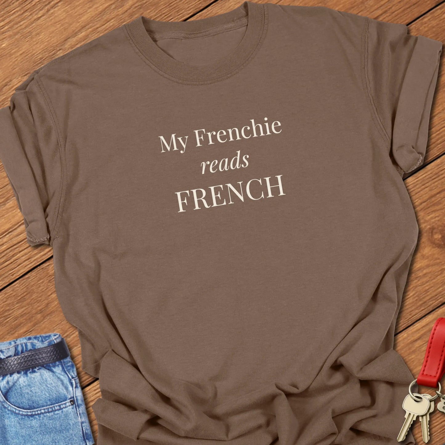 A Comfort Colors® garment-dyed shirt in Espresso featuring a popular retro typewritter font featuring the funny slogan "My Frenchie Reads French."
