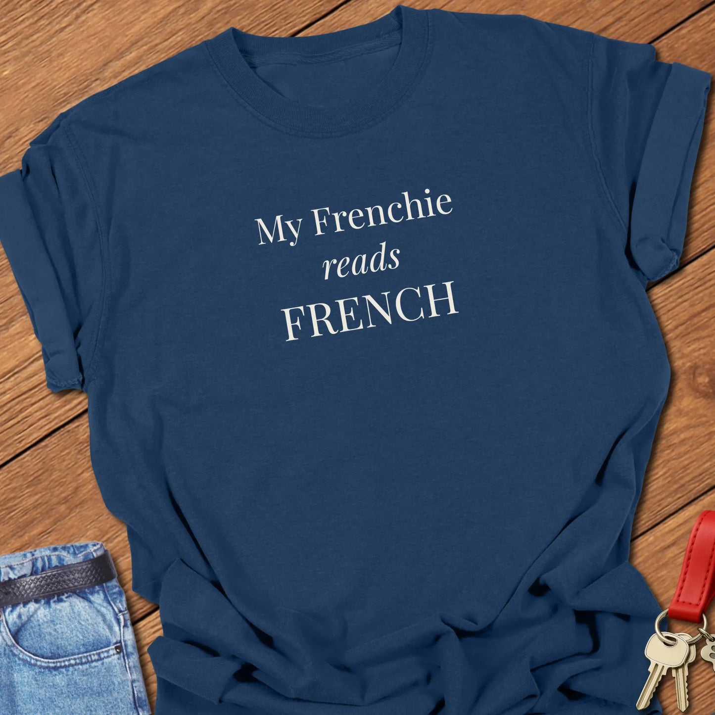 A Comfort Colors® garment-dyed shirt in True Navy featuring a popular retro typewritter font featuring the funny slogan "My Frenchie Reads French."