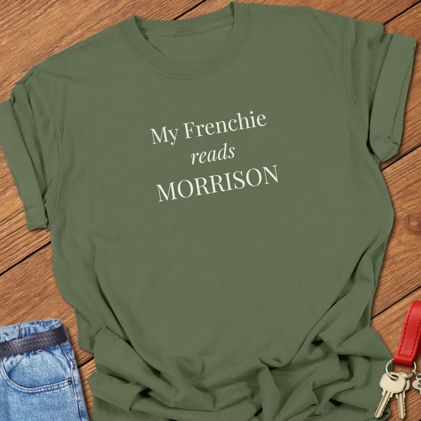 A Comfort Colors® garment-dyed shirt in Moss with elegant serif typography featuring My Frenchie Reads Morrison" text.
