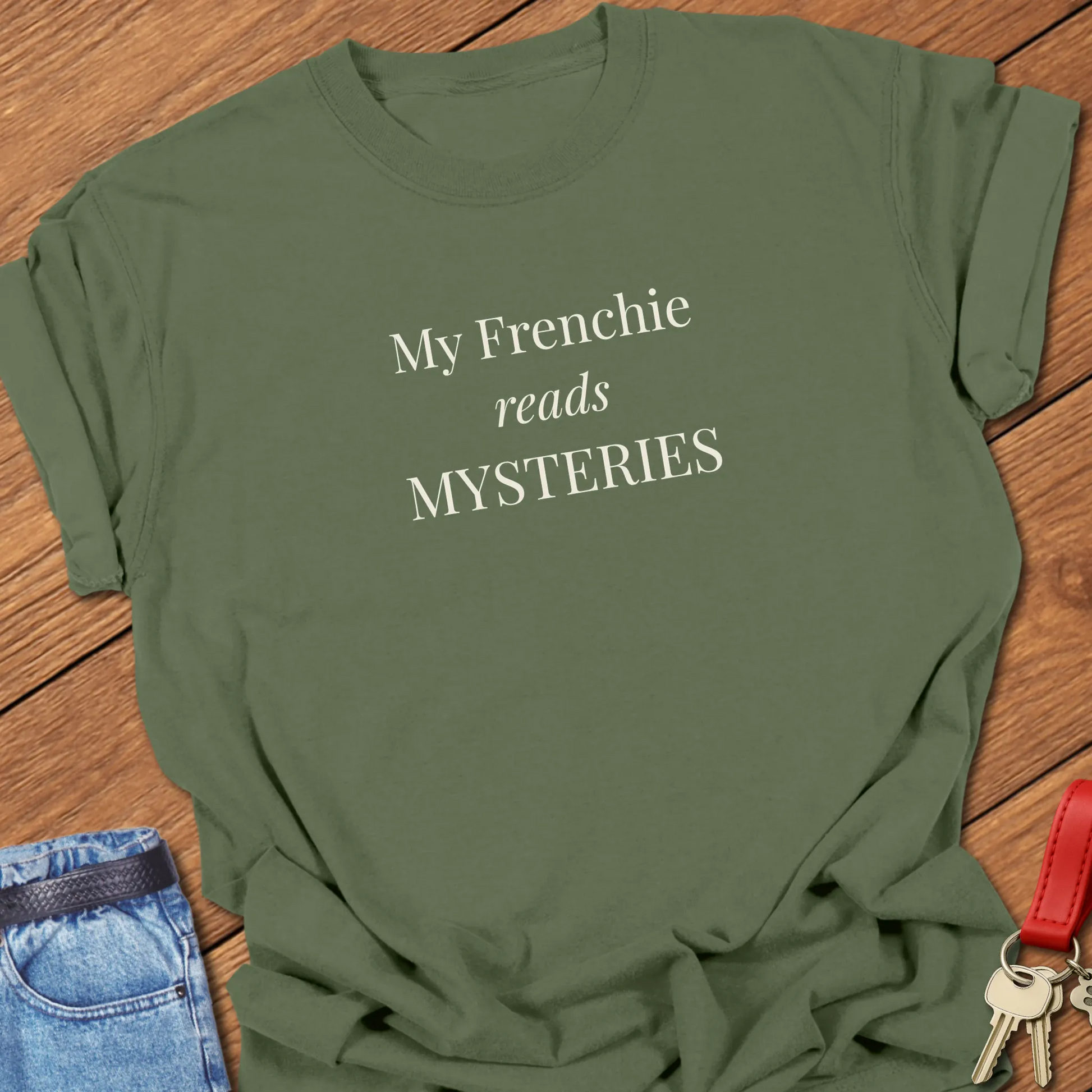 A Comfort Colors® garment-dyed shirt in Moss featuring a popular retro typewriter font printed with the funny slogan "My Frenchie Reads French."