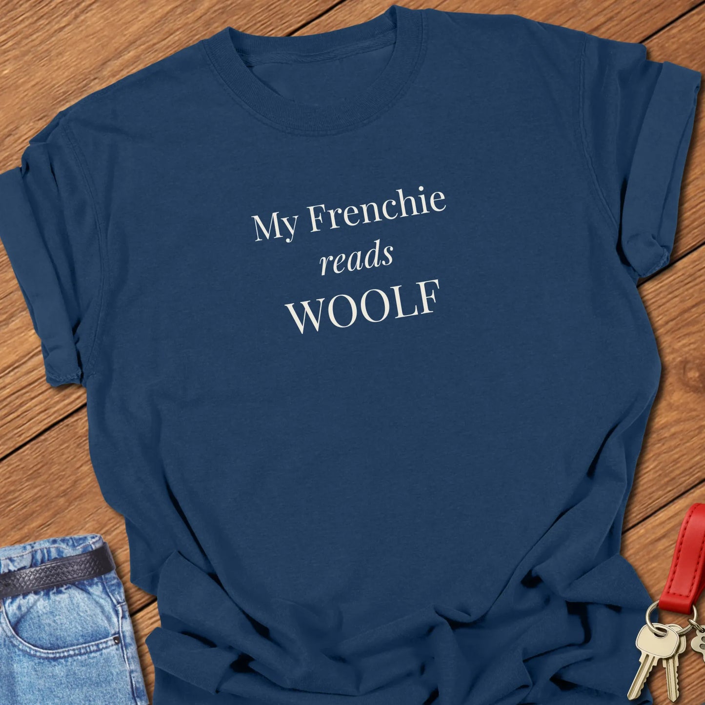 My Frenchie Reads Woolf French Bulldog t-shirt displayed on a True Navy Comfort Colors® garment-dyed shirt featuring elegant serif typography.